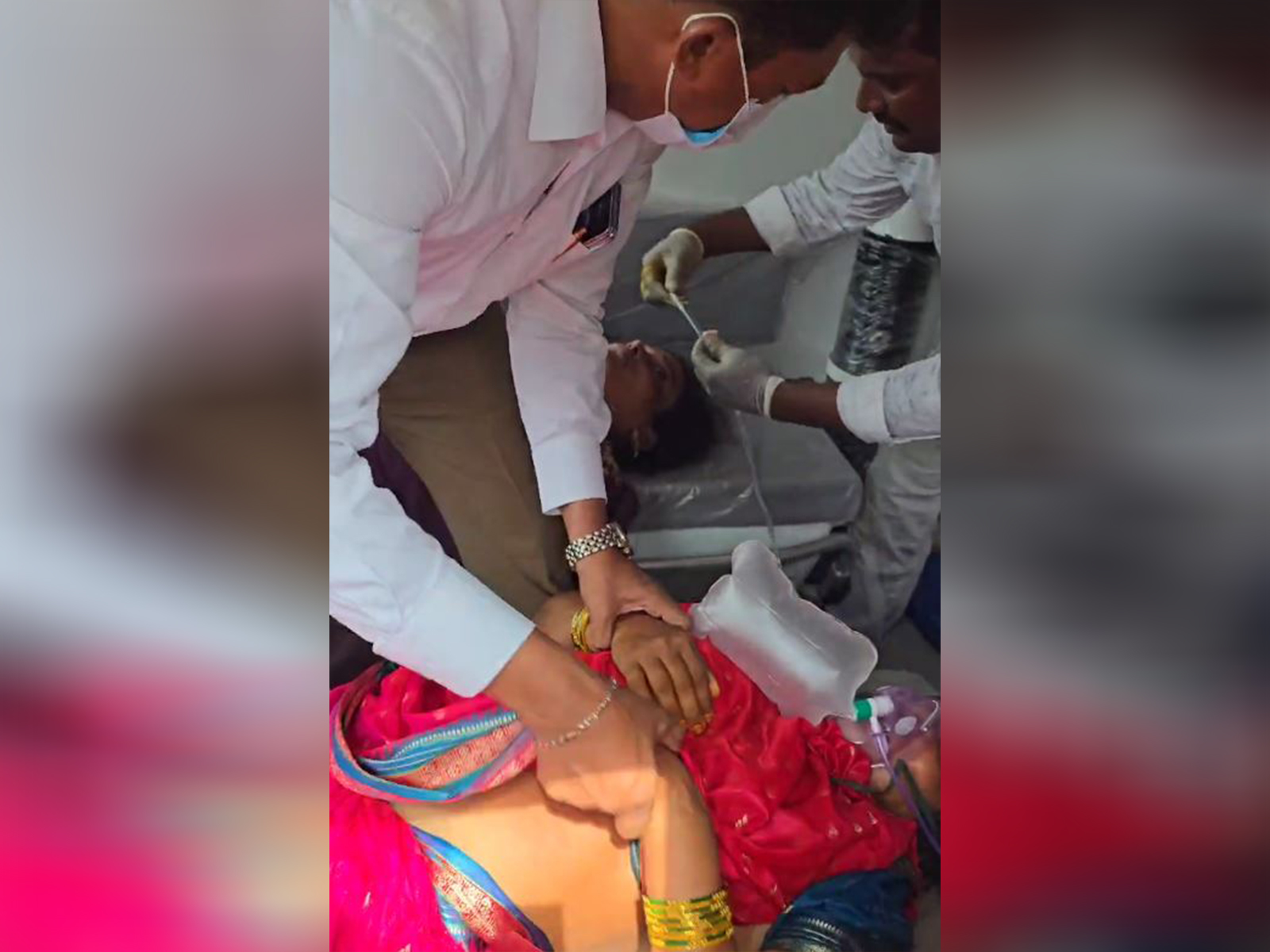 YSR Doctors cell member aids injured in stampede (Photo/ANI) YSR Doctors cell member aids injured in stampede (Photo/ANI)