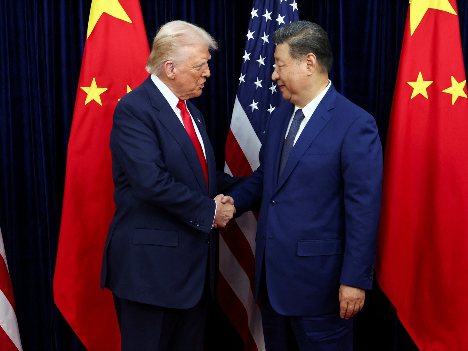 US President Donald Trump meets with Chinese President Xi Jinping on the sidelines of the APEC summit, in Busan (File Photo/Reuters) US President Donald Trump meets with Chinese President Xi Jinping on the sidelines of the APEC summit, in Busan (File Photo/Reuters)