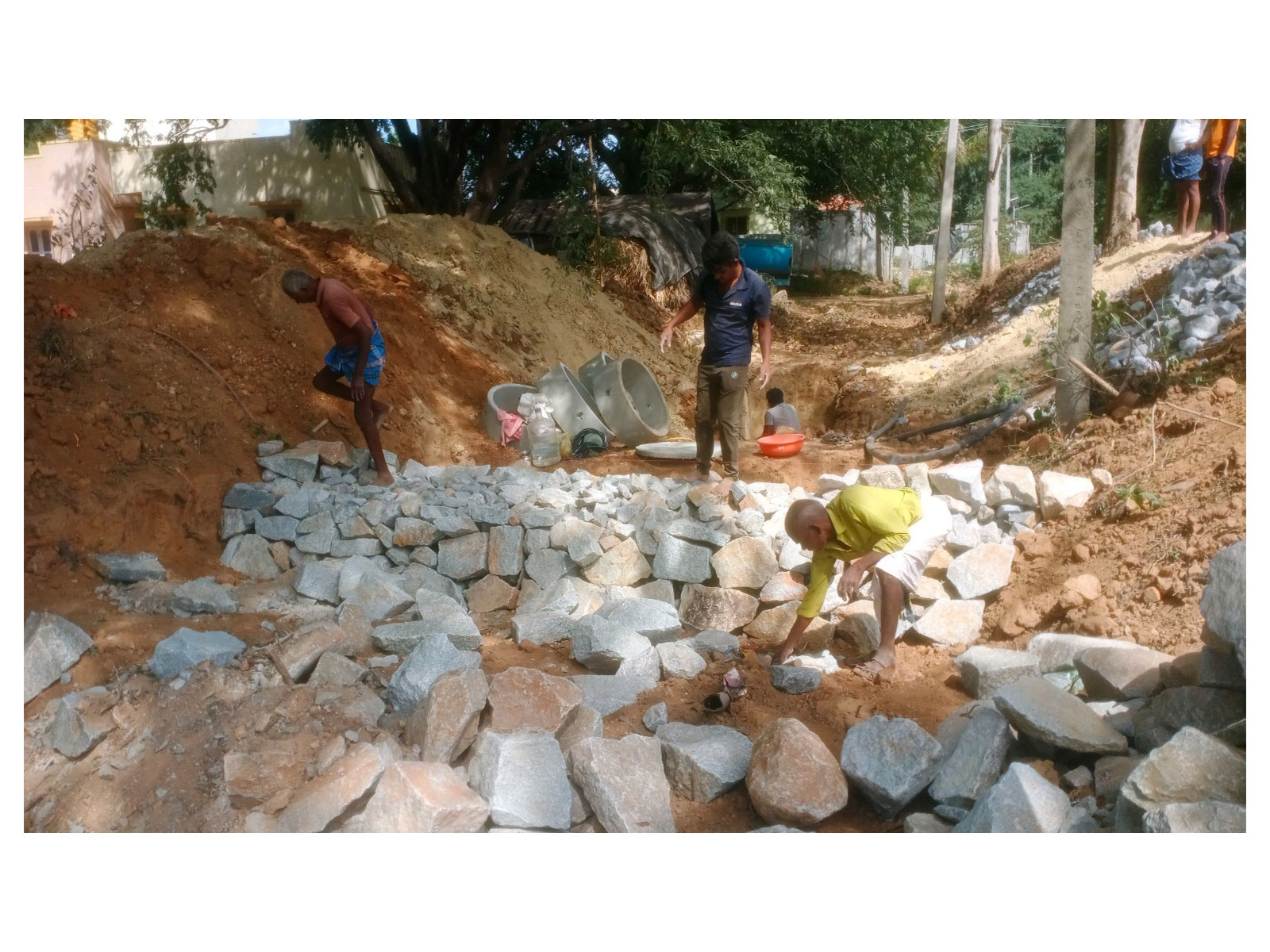 Building boulder checks, slowing the rush of water to help it soak deep into the earth Building boulder checks, slowing the rush of water to help it soak deep into the earth
