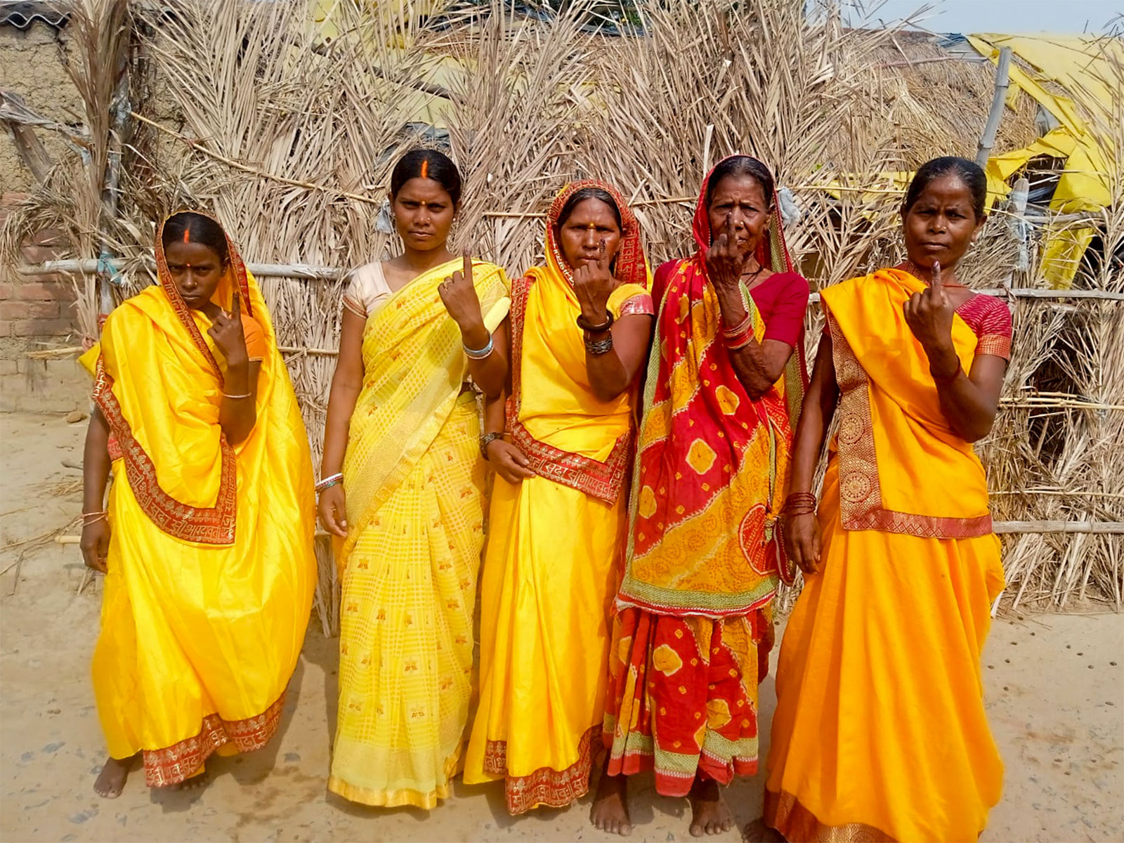 Voters show their ink-marked fingers after casting their votes. (Photo/ANI) Voters show their ink-marked fingers after casting their votes. (Photo/ANI)