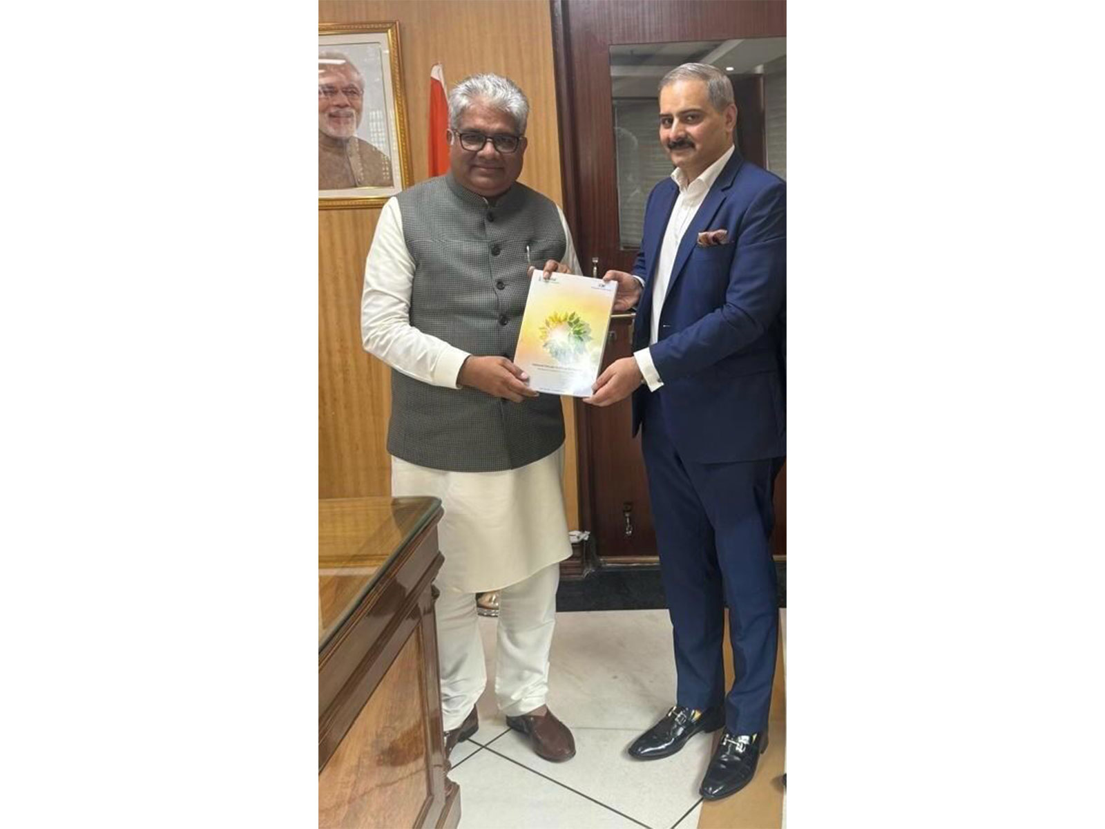 Image of Mr. Masood handing over the first copy of NCEF 3 to Shri Bupendar Yadav, Hon'ble Minister of Environment, Forest, and Climate Change. Image of Mr. Masood handing over the first copy of NCEF 3 to Shri Bupendar Yadav, Hon'ble Minister of Environment, Forest, and Climate Change.