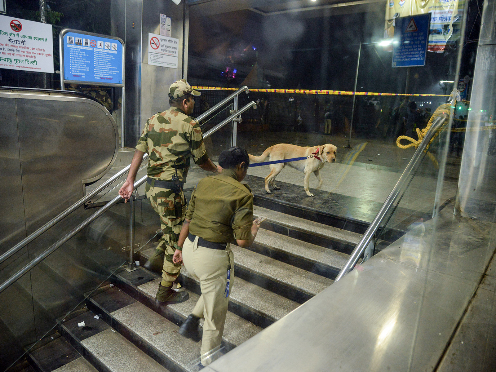 Security personnel with a sniffer dog at the Lal Quila metro station's gate no 1 (Photo/ANI) Security personnel with a sniffer dog at the Lal Quila metro station's gate no 1 (Photo/ANI)