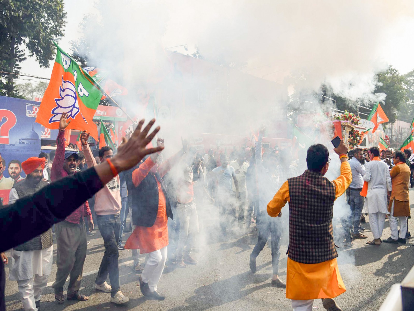 BJP supporters burst crackers to celebrate NDA's lead in the Bihar assembly election in Patna on Friday. (Photo/ANI)