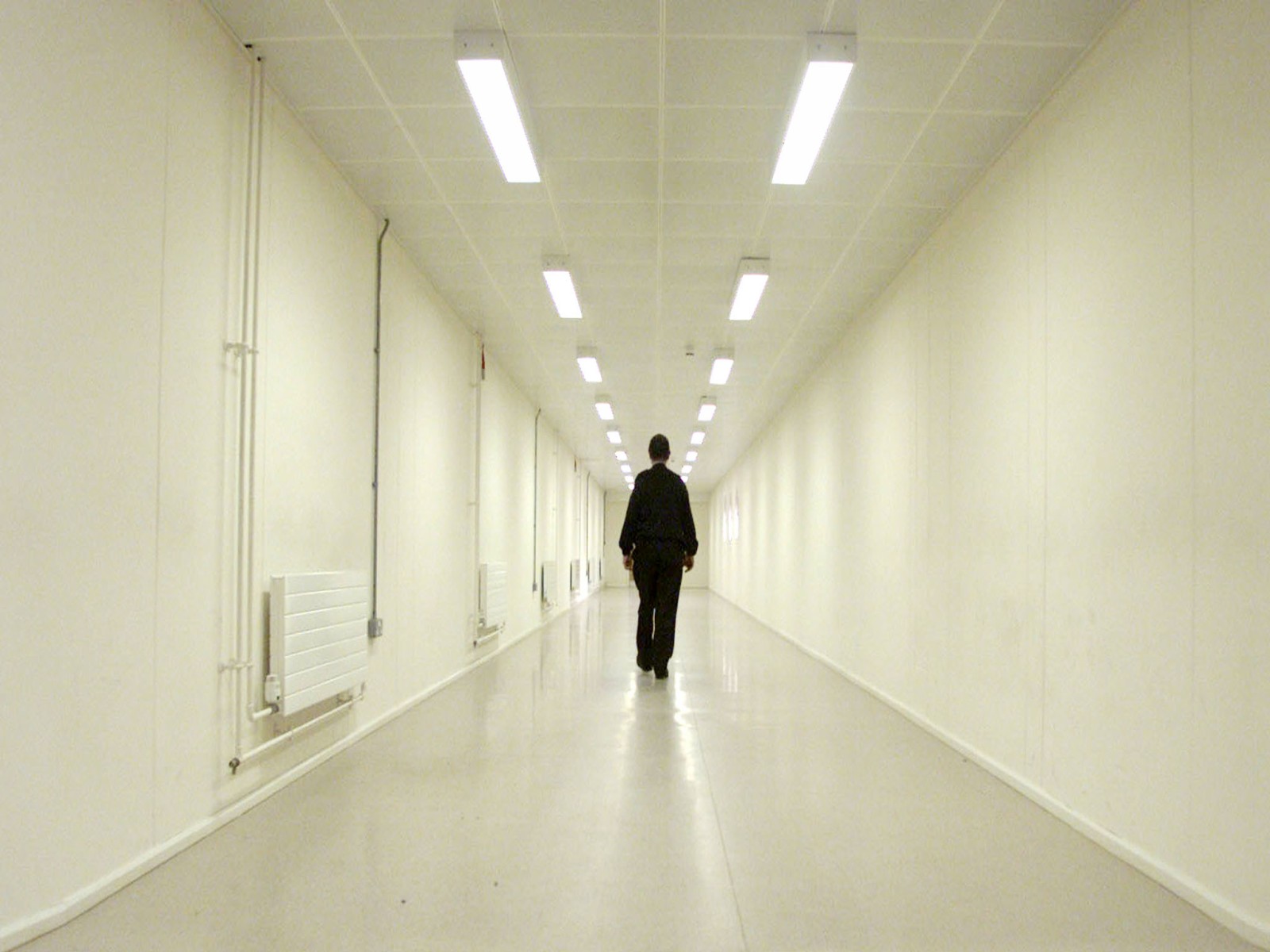 A Group 4 security officer walks down one of the corridors of Yarl's Wood Immigration Removal Centre, Europe's largest detention centre for illegal immigrants, in Bedford (Photo/Reuters) A Group 4 security officer walks down one of the corridors of Yarl's Wood Immigration Removal Centre, Europe's largest detention centre for illegal immigrants, in Bedford (Photo/Reuters)