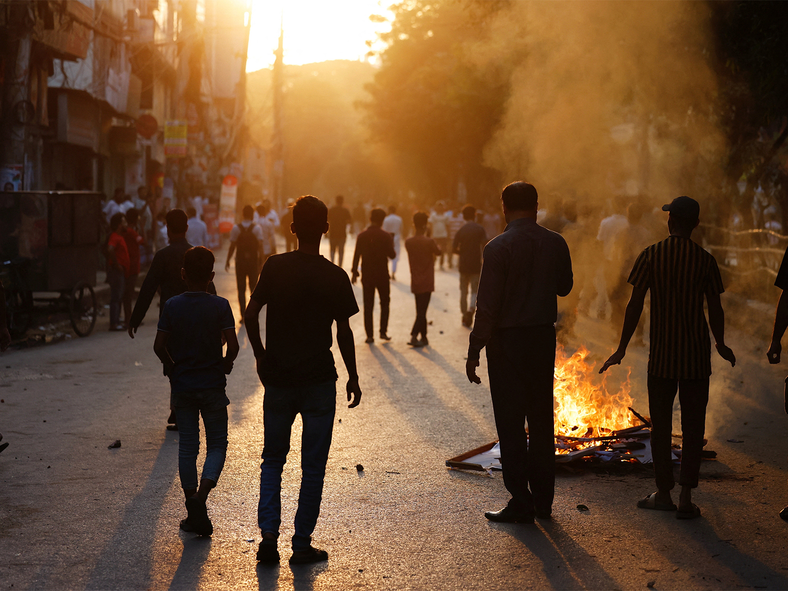 Anti-Hasina demonstrators set fire on a street during a clash, after the verdict on cases against the ousted Prime Minister Sheikh Hasina, in Dhaka (Photo/Reuters) Anti-Hasina demonstrators set fire on a street during a clash, after the verdict on cases against the ousted Prime Minister Sheikh Hasina, in Dhaka (Photo/Reuters)