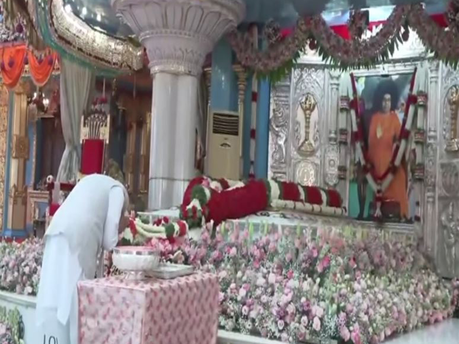 Prime Minister Narendra Modi offers obeisance at Mahasamadhi of Sri Sathya Sai Baba (Photo/ANI) Prime Minister Narendra Modi offers obeisance at Mahasamadhi of Sri Sathya Sai Baba (Photo/ANI)