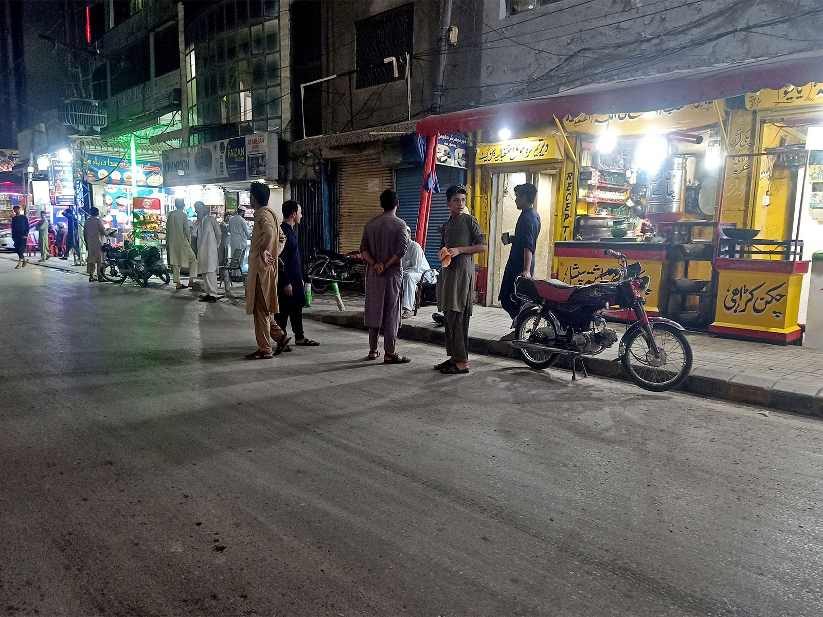 People stand in the street after they vacated eateries following an earthquake in Peshawar (File Photo/Reuters) People stand in the street after they vacated eateries following an earthquake in Peshawar (File Photo/Reuters)