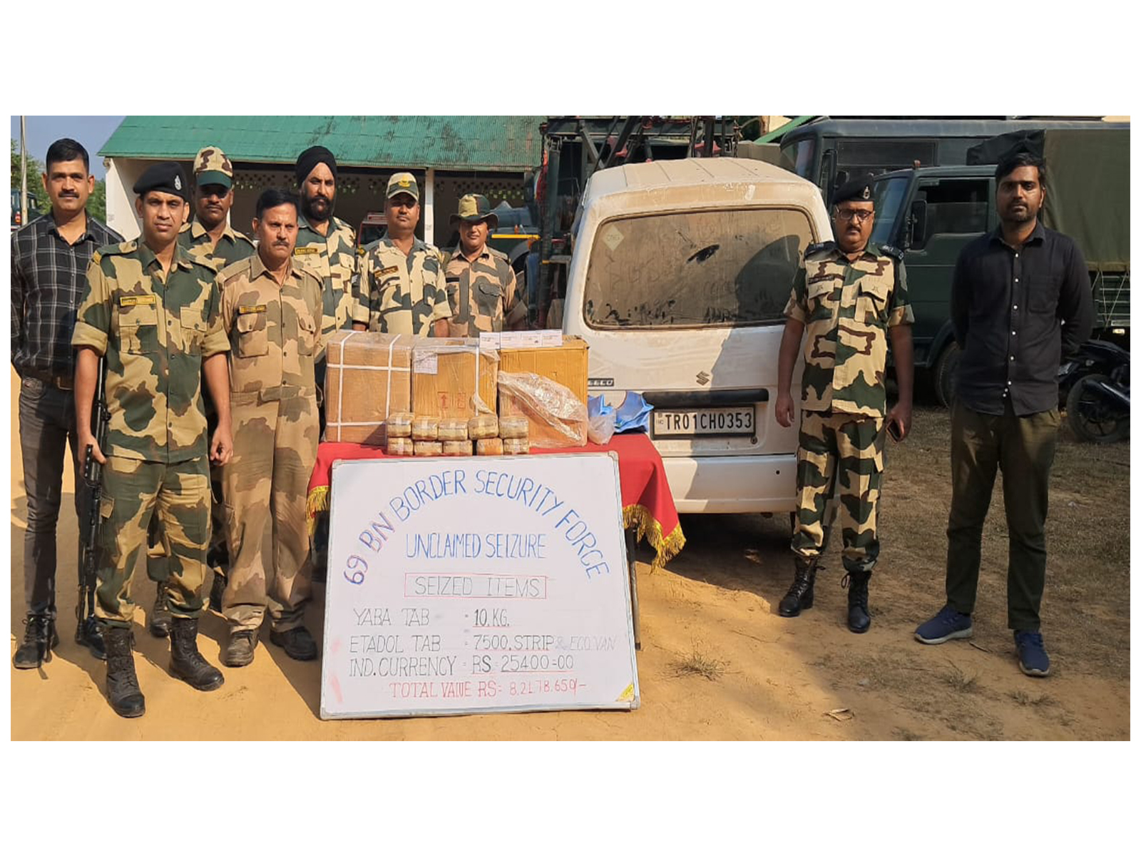 BSF officers displaying the seized drugs and vehicle during an operation in Tripura (Photo/BSF HQ)