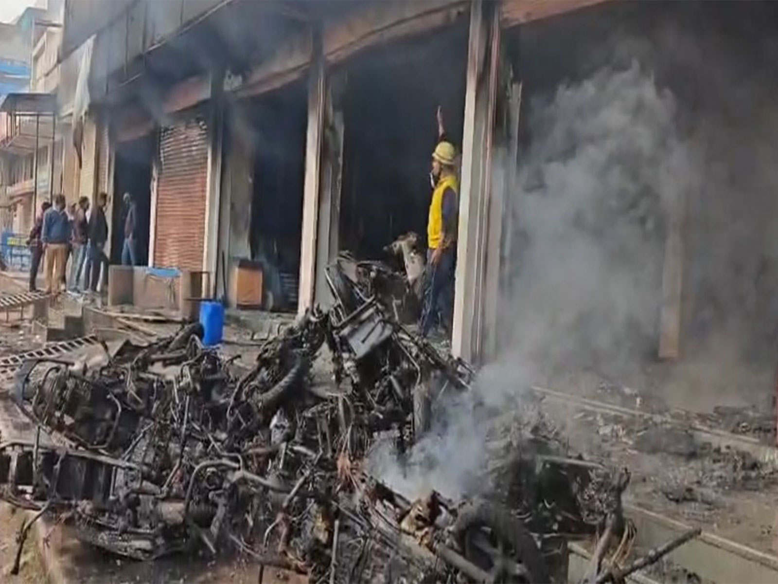 Burnt EV bikes outside the showroom in Kota, Rajasthan on Wednesday. (Photo/ANI) Burnt EV bikes outside the showroom in Kota, Rajasthan on Wednesday. (Photo/ANI)