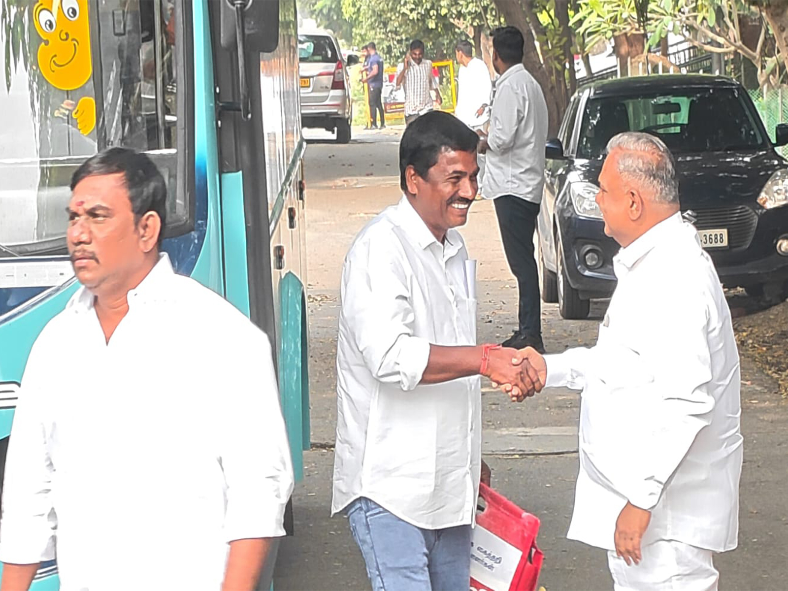 TVK General Secretary N Anand (right) welcoming KA Sengottaiyan supporters outside party office (Photo/ANI) TVK General Secretary N Anand (right) welcoming KA Sengottaiyan supporters outside party office (Photo/ANI)