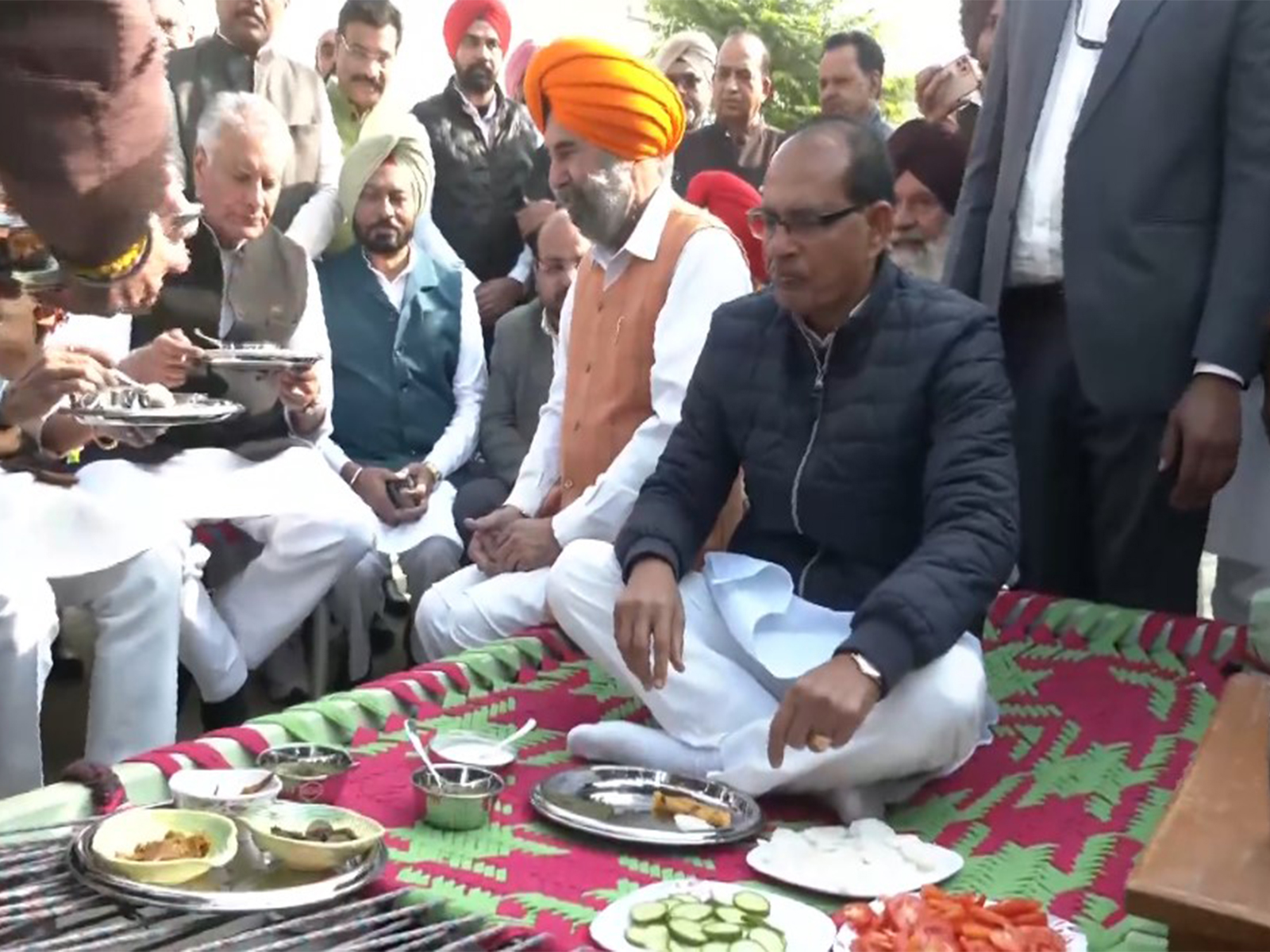 Union Minister Shivraj Singh Chouhan having a meal with the locals of Ransih Kalan village in Moga, Punjab on Thursday. (Photo/ANI) Union Minister Shivraj Singh Chouhan having a meal with the locals of Ransih Kalan village in Moga, Punjab on Thursday. (Photo/ANI)