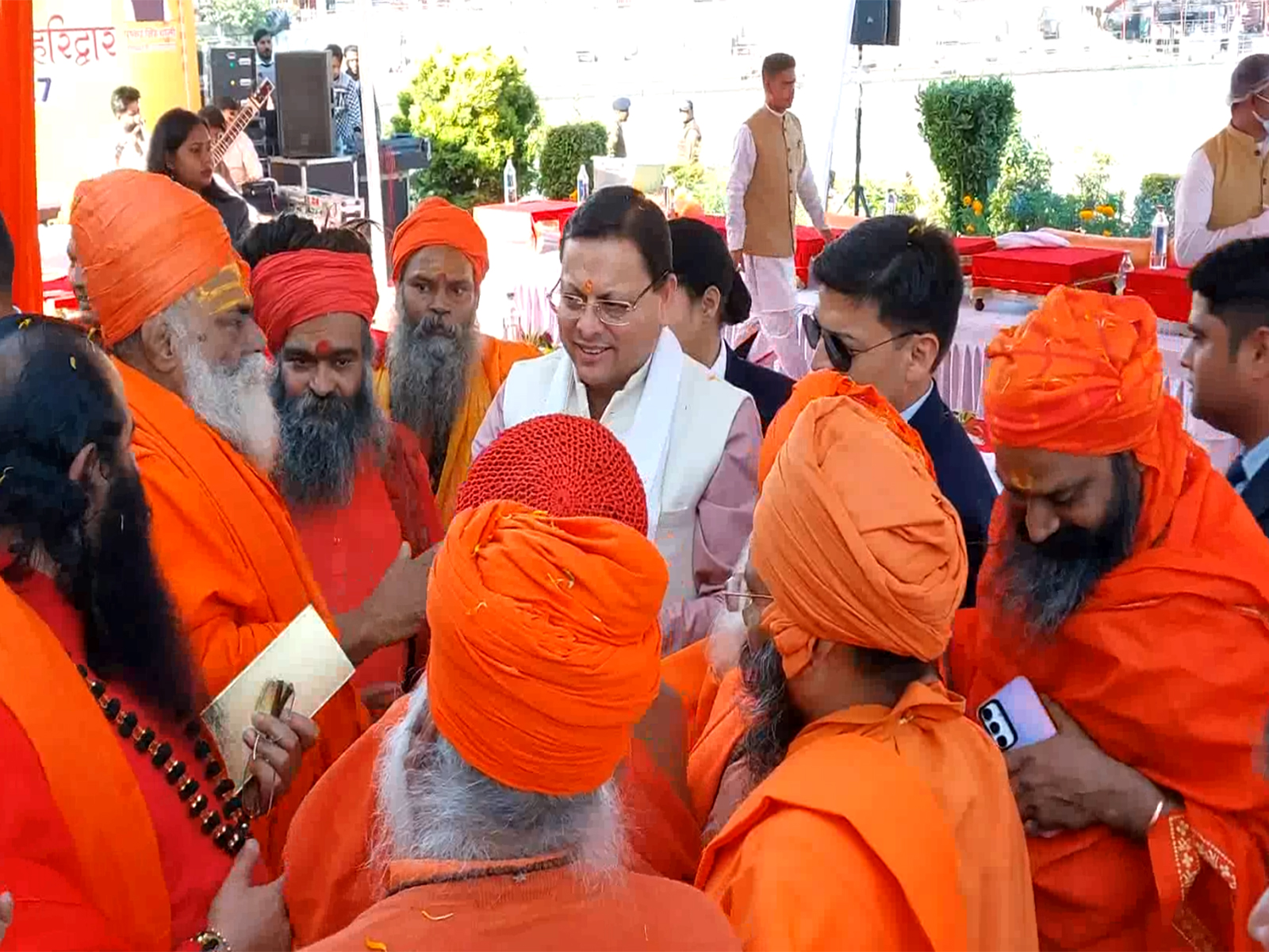 CM Dhami with Acharyas and saints of all 13 Akharas. (Photo/ANI) CM Dhami with Acharyas and saints of all 13 Akharas. (Photo/ANI)