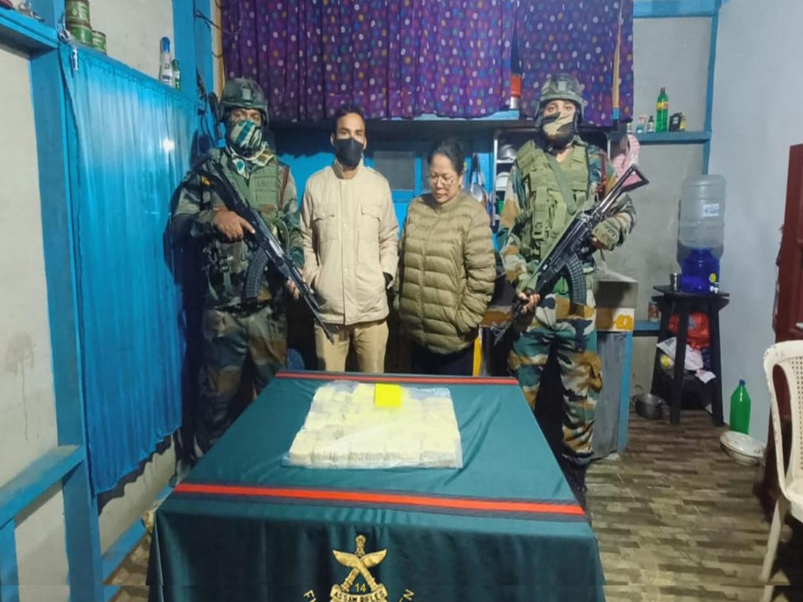 Assam Rifles Personnel with recovered Methamphetamine Tablets and Trafficker Zolianthangi (Photo/Assam Rifles) Assam Rifles Personnel with recovered Methamphetamine Tablets and Trafficker Zolianthangi (Photo/Assam Rifles)