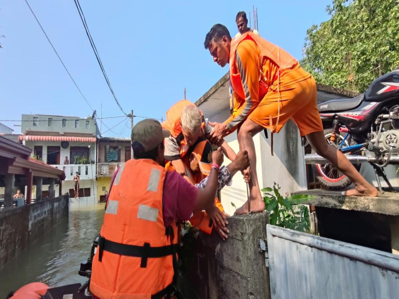 NDRF teams help evacuate people during flood rescue under Operation Sagar Bandhu. (Photo: X/@IndiainSL) NDRF teams help evacuate people during flood rescue under Operation Sagar Bandhu. (Photo: X/@IndiainSL)