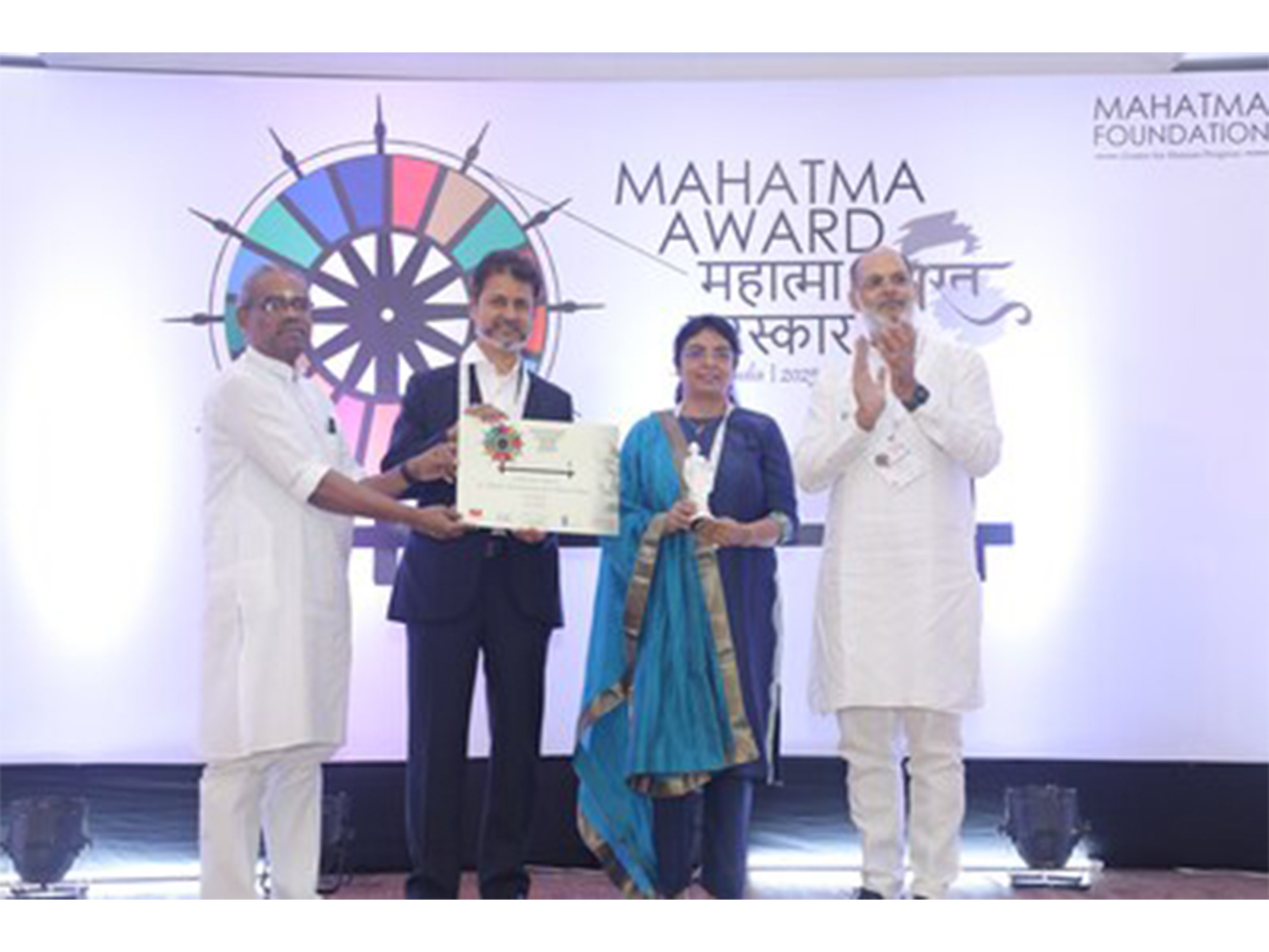 Sunil Balakrishnan, Chief Values Officer, and Smita Sharma, Global Program Manager, UST, receiving the award