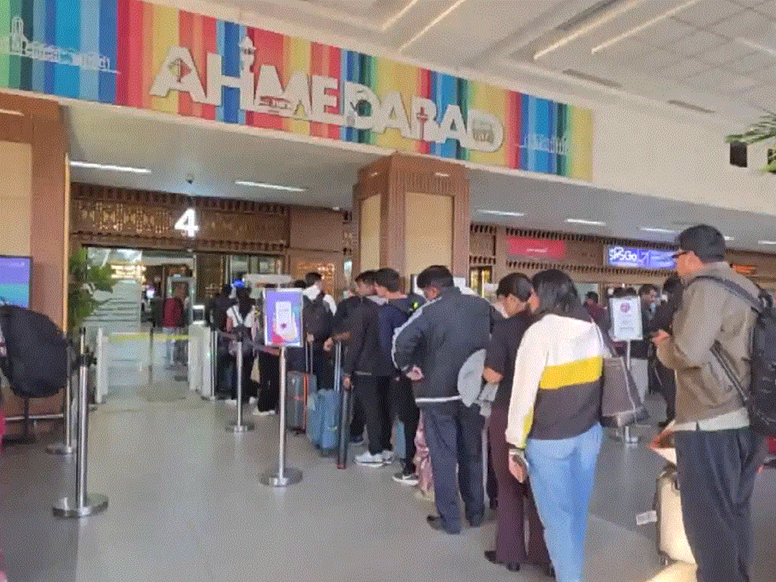 People standing in a queue at Sardar Vallabhbhai Patel International Airport in Ahmedabad, Gujarat (Photo/ANI) People standing in a queue at Sardar Vallabhbhai Patel International Airport in Ahmedabad, Gujarat (Photo/ANI)