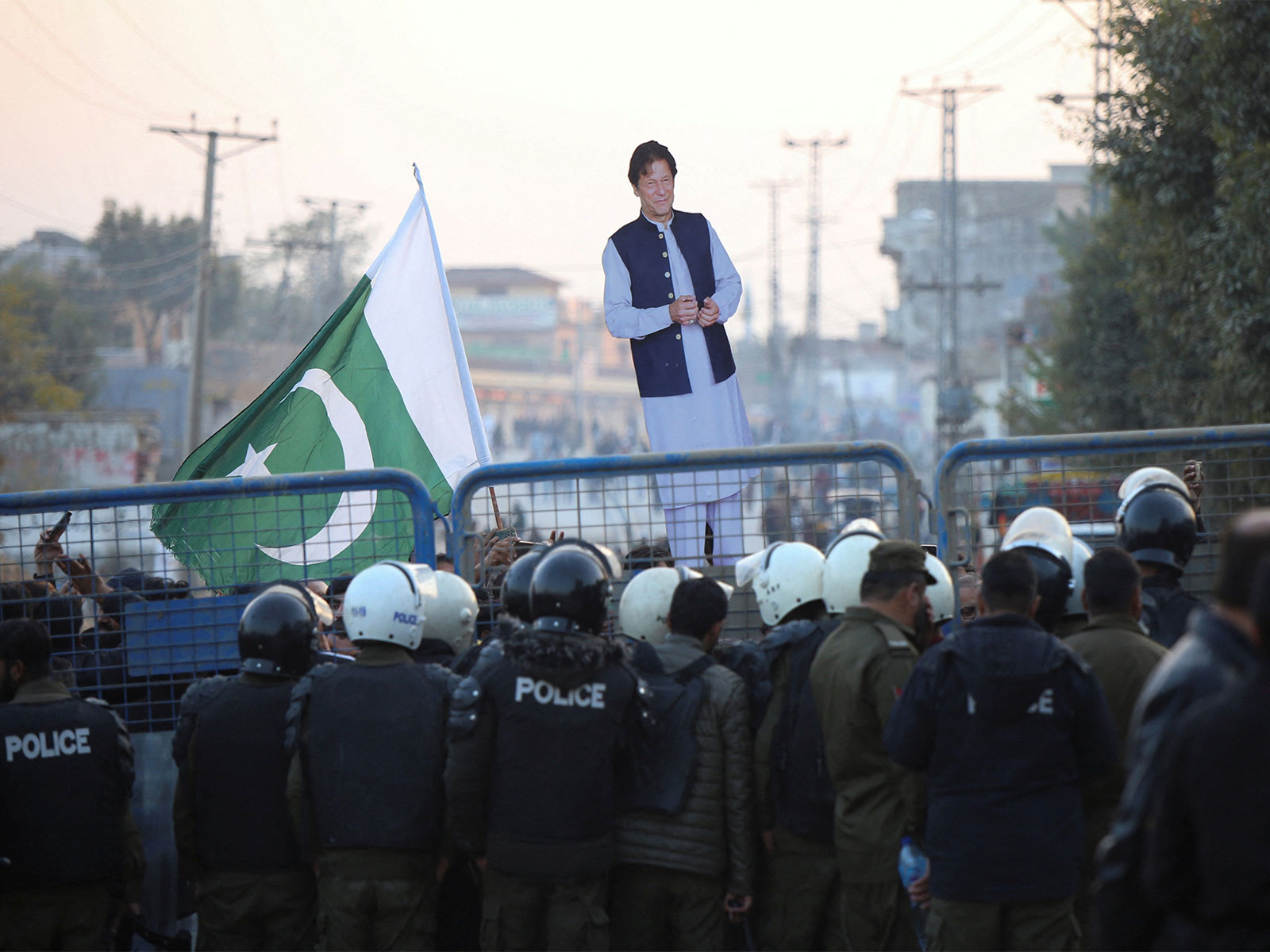 A supporter holds a cutout of former PM Imran Khan during a protest over his health concerns (Photo/ Reuters) A supporter holds a cutout of former PM Imran Khan during a protest over his health concerns (Photo/ Reuters)