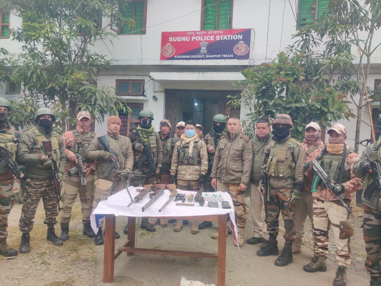 Manipur Police with the cache of recovered arms. (Photo/Manipur Police)