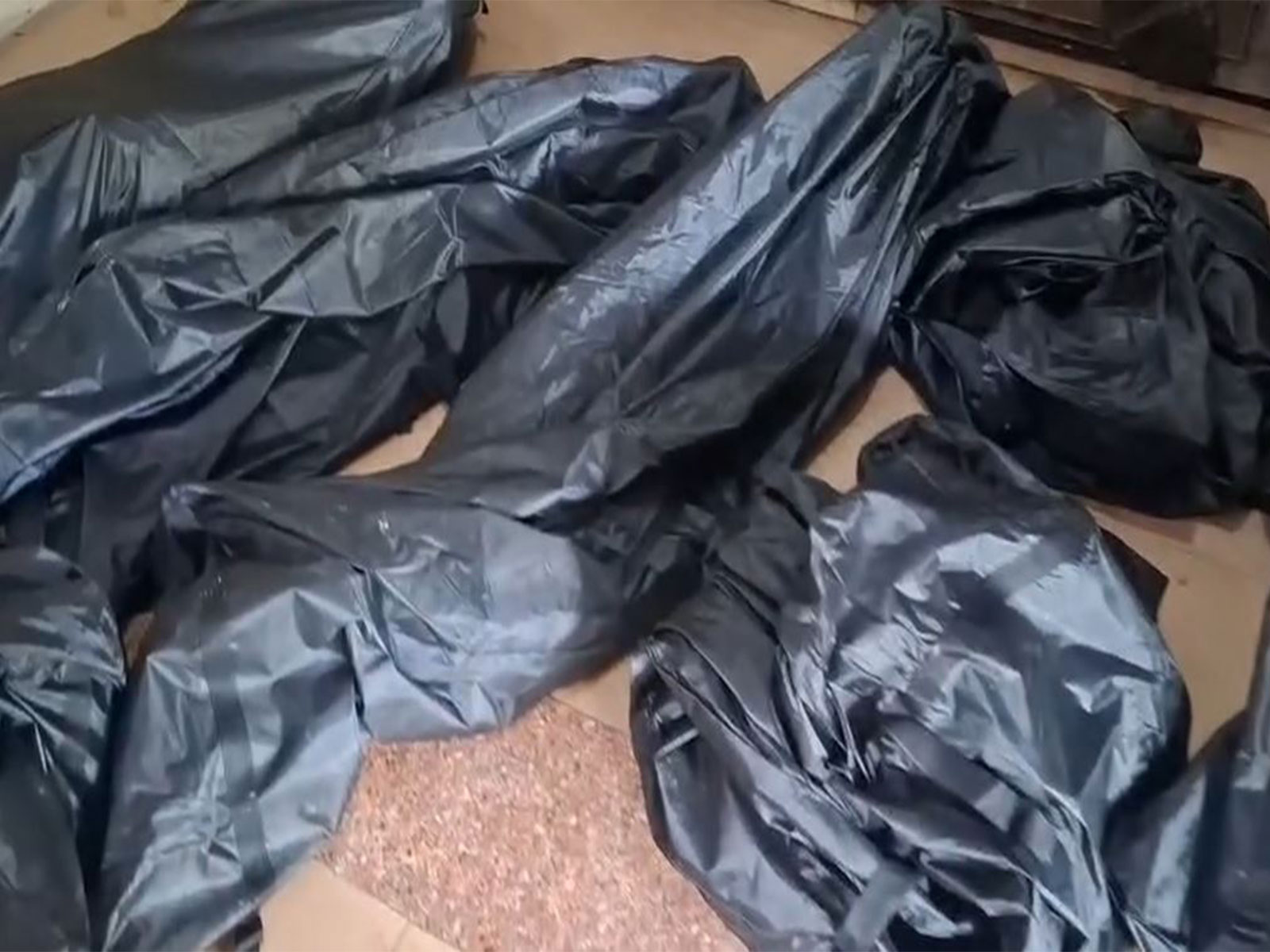 Deceased in body bags at postmortem house in Mathura (Photo/ANI) Deceased in body bags at postmortem house in Mathura (Photo/ANI)