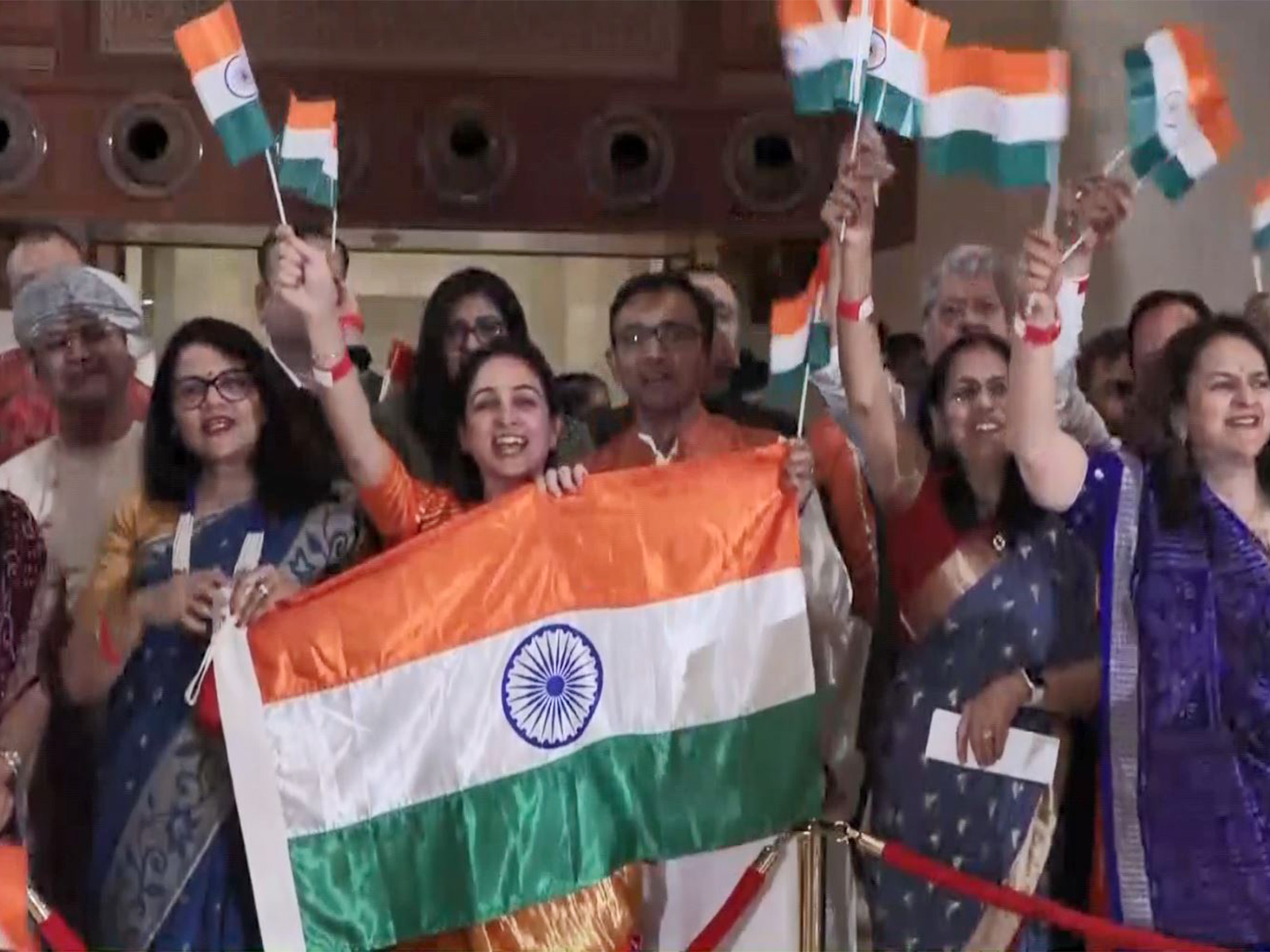 Indian diaspora members in Muscat chant slogans as Prime Minister Narendra Modi arrives for the final leg of his three-nation visit (Photo/ANI) Indian diaspora members in Muscat chant slogans as Prime Minister Narendra Modi arrives for the final leg of his three-nation visit (Photo/ANI)