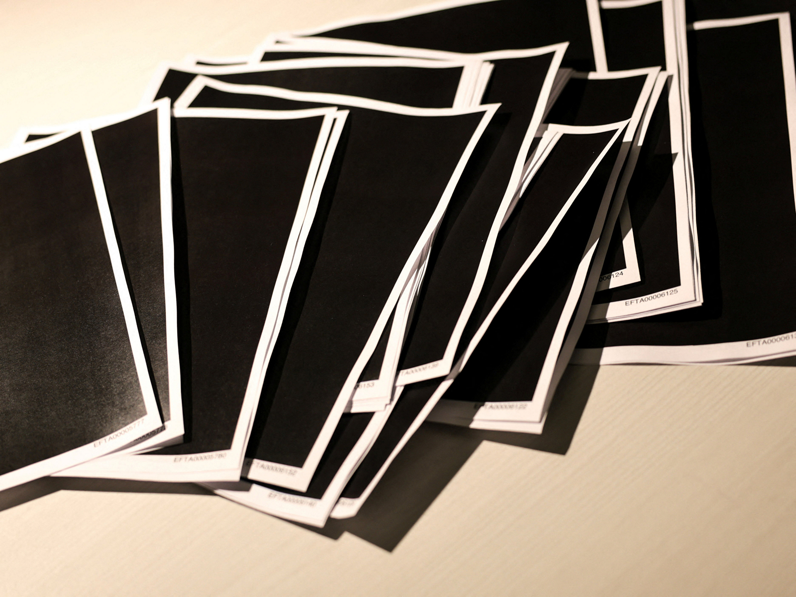 Newly-released documents from disgraced late financier and sex offender Jeffrey Epstein, including a sheaf of entirely redacted pages, are seen in this handouts released by the US Justice Department (Photo/Reuters) Newly-released documents from disgraced late financier and sex offender Jeffrey Epstein, including a sheaf of entirely redacted pages, are seen in this handouts released by the US Justice Department (Photo/Reuters)