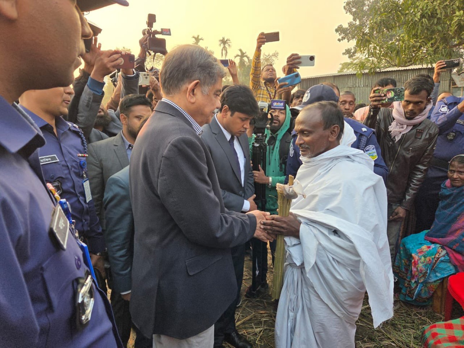 Education Adviser CR Abrar speaks to Rabilal Das, father of Dipu Chanrda Das (Photo/ X@ChiefAdviserGoB) Education Adviser CR Abrar speaks to Rabilal Das, father of Dipu Chanrda Das (Photo/ X@ChiefAdviserGoB)