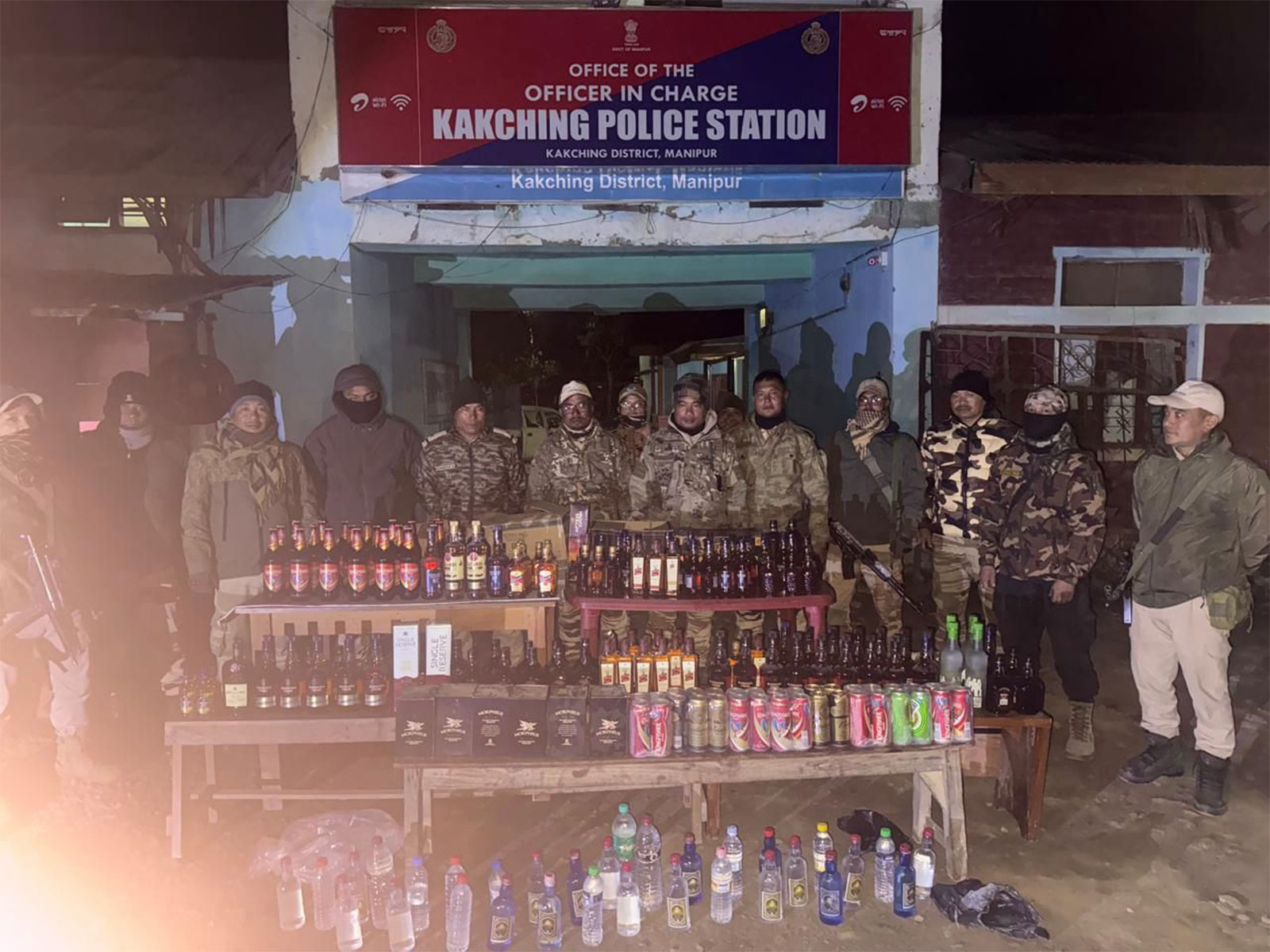 Police with the seized liquor at the Kakching Police Station in Manipur (Photo/Manipur Police) Police with the seized liquor at the Kakching Police Station in Manipur (Photo/Manipur Police)