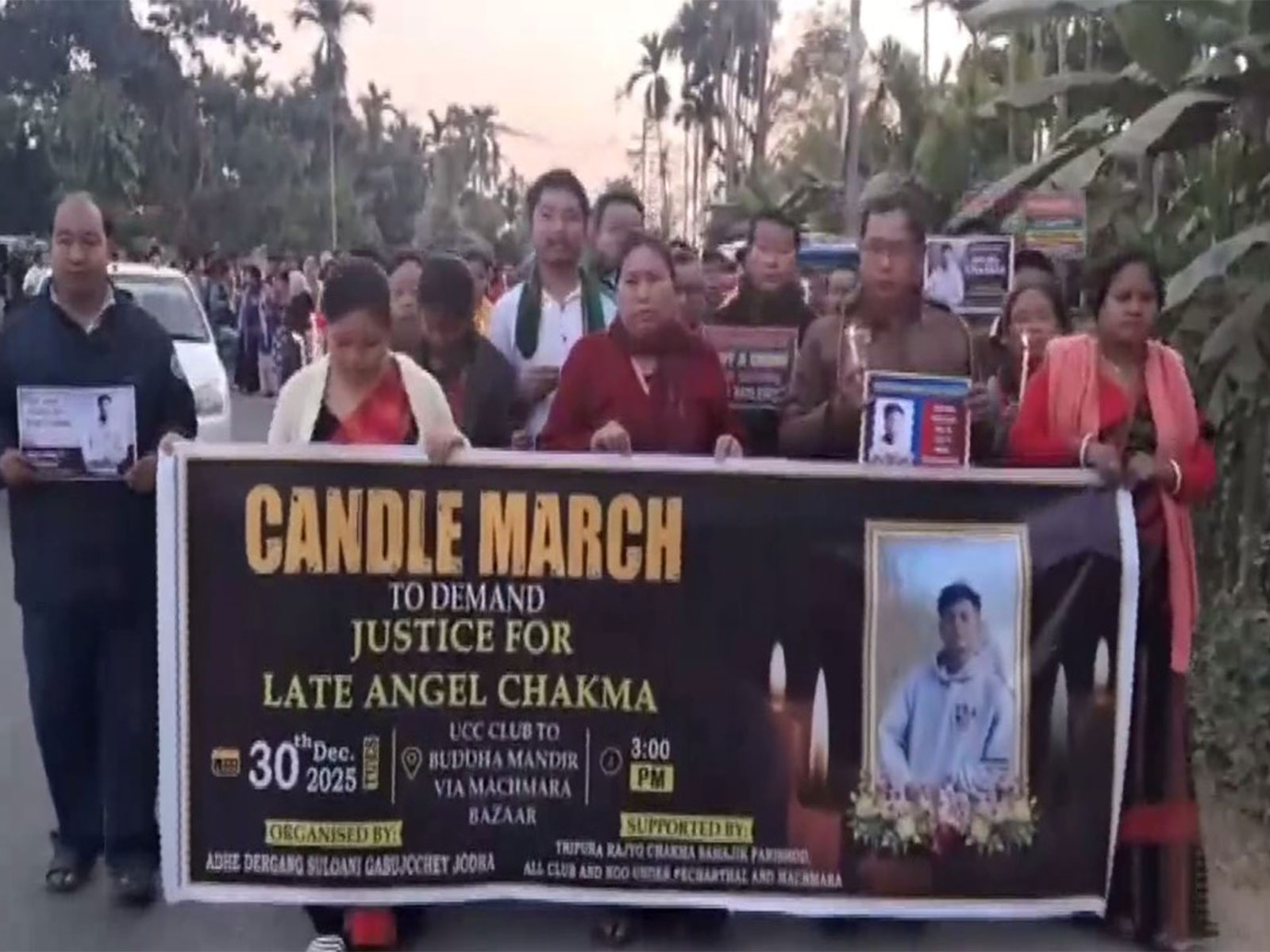People hold candle march in Agartala (Photo: ANI)