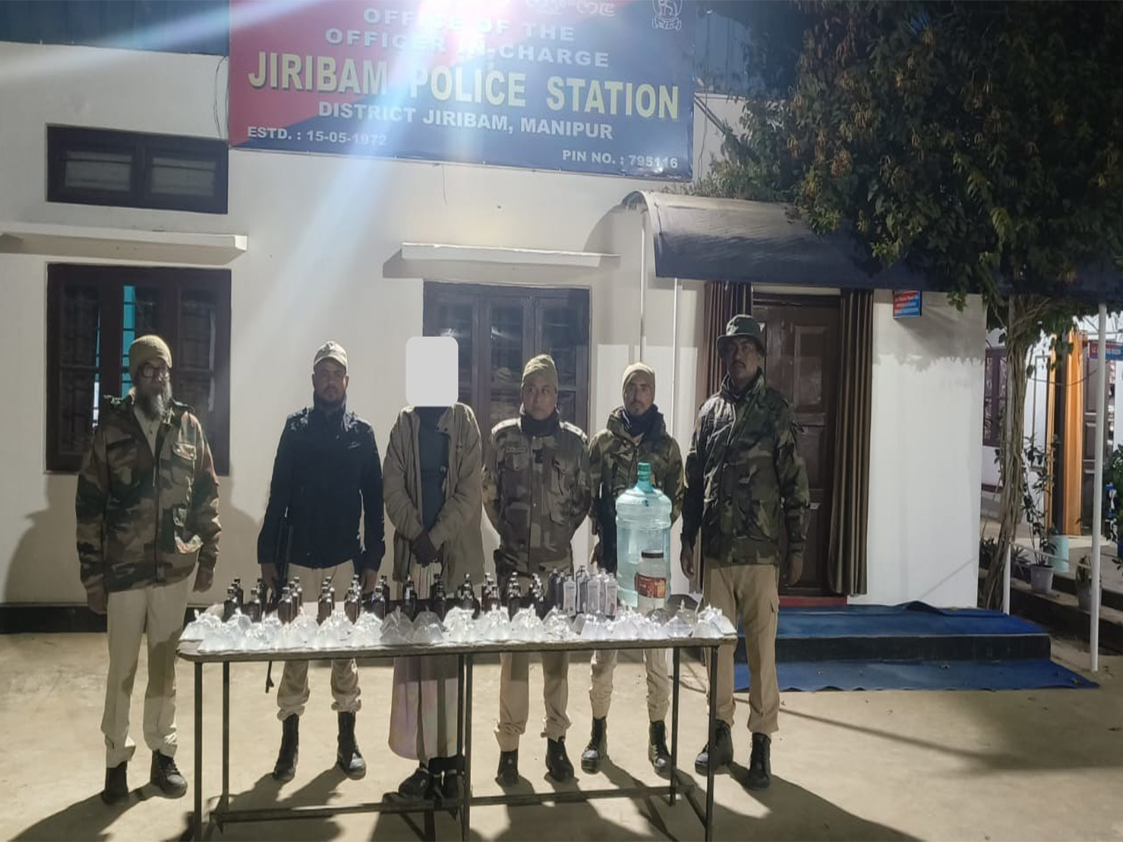 Manipur Police with seized DIC liquor and IMFL bottles after apprehending a man from Latingkhal Part-II in Jiribam district (Photo: x/@manipur_police) Manipur Police with seized DIC liquor and IMFL bottles after apprehending a man from Latingkhal Part-II in Jiribam district (Photo: x/@manipur_police)