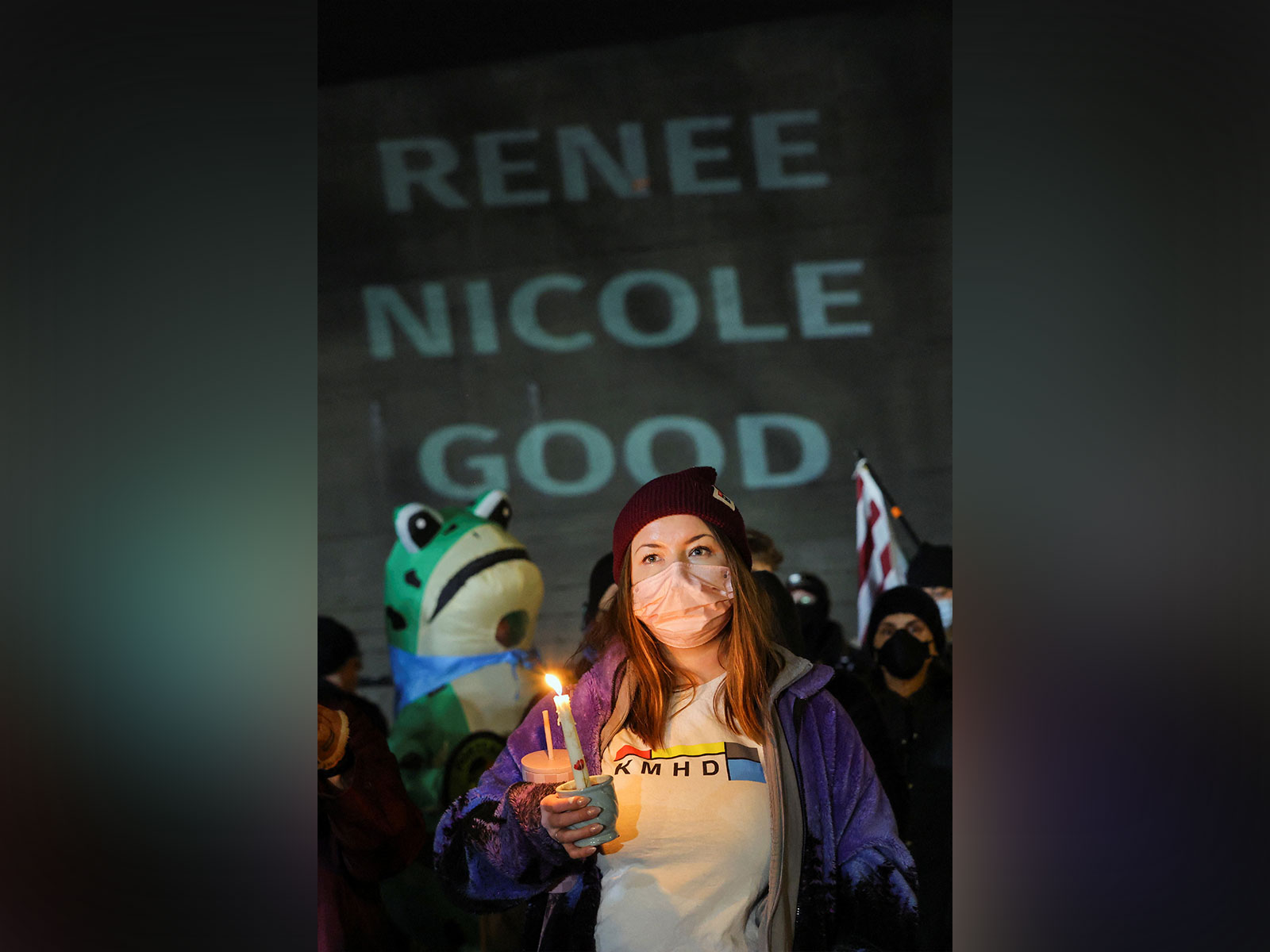 A woman holds a candle as people gather during a vigil (Photo/Reuters) A woman holds a candle as people gather during a vigil (Photo/Reuters)
