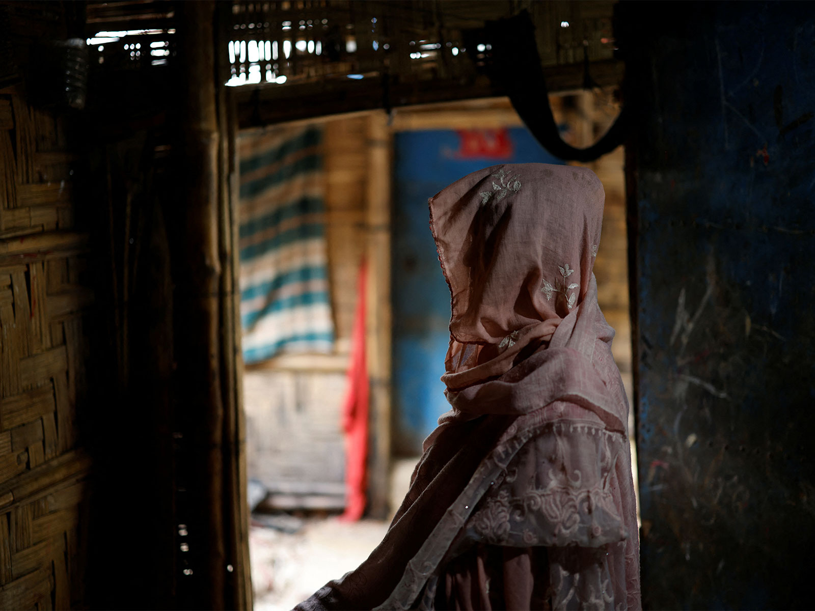 Ajib Bahar, 38, a newly-arrived Rohingya refugee poses for a picture inside her shelter at a refugee camp in Cox's Bazar, Bangladesh (Photo/Reuters)