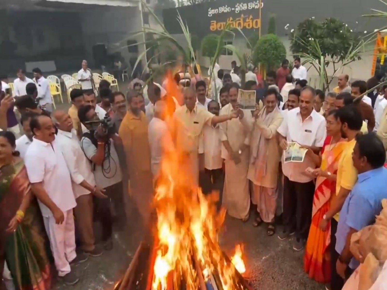 TDP cadre burns posters of former CM YS Jagan Mohan Reddy during Bhogi celebrations in Vijaywada (Photo/ANI)
