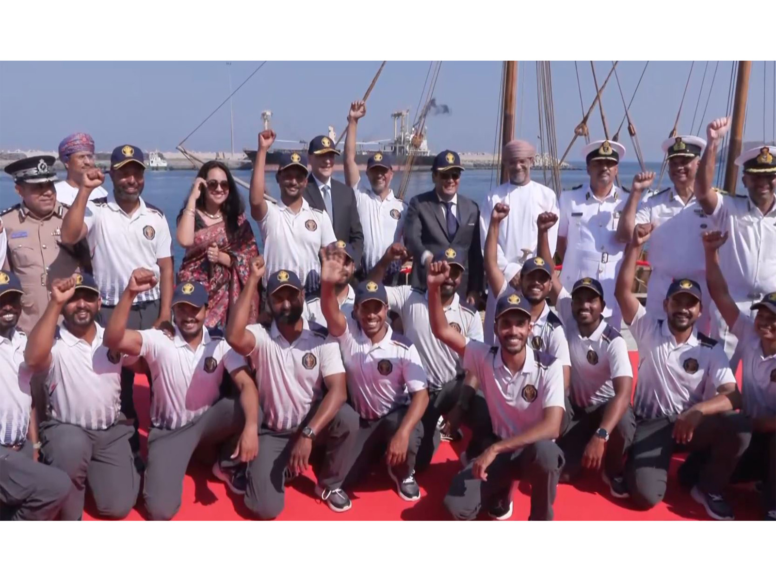 Crew members of INSV Kaundinya celebrate after the vessel docks in Muscat upon completing its maiden overseas voyage from Porbandar, Gujarat. (Photo/ANI)