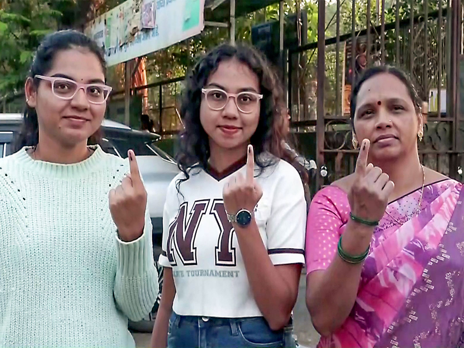 Voters show their ink-marked fingers after casting votes for BMC election, in Mumbai on Thursday (Photo/ANI)