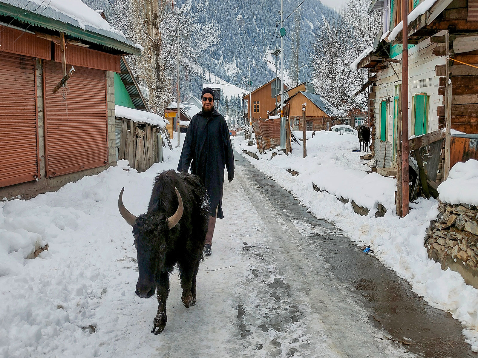 A view of the snow‑covered Achoora village area of Gurez valley of J&K. (Photo/ANI)