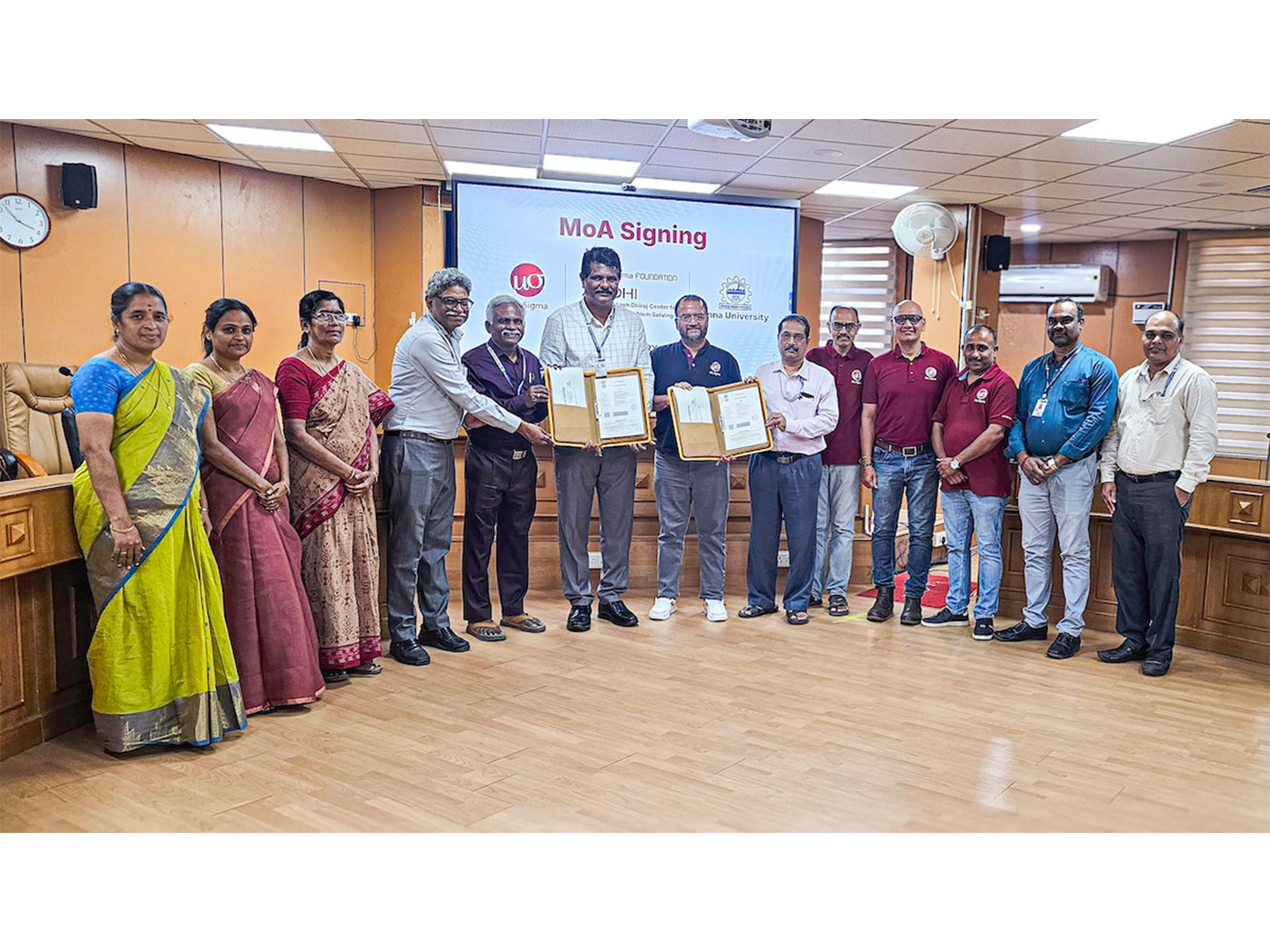Dhiraj Rajaram, CEO, Mu Sigma, Prof. Kumaresan, Registrar, Anna University, and others, at the signing.