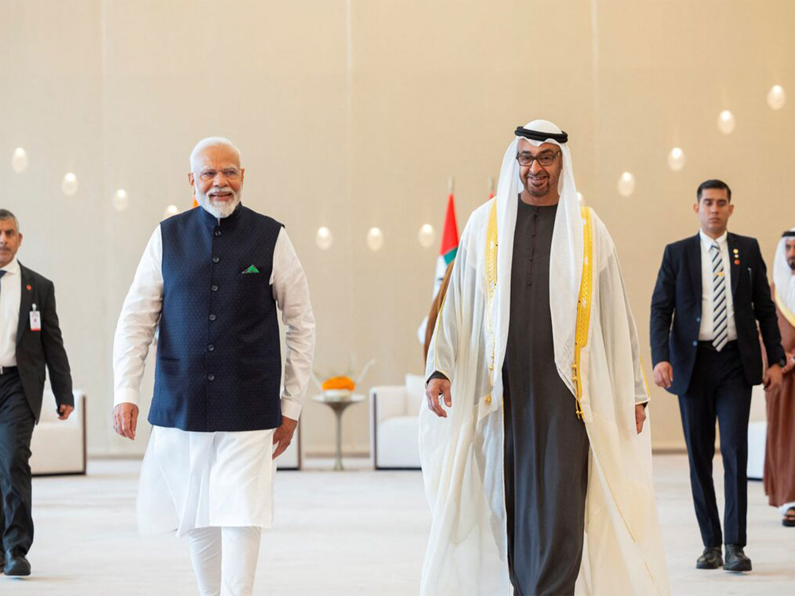 UAE President Sheikh Mohamed bin Zayed Al Nahyan walks with Prime Minister Narendra Modi during a reception at the Presidential Airport in Abu Dhabi, United Arab Emirates. (Photo/Reuters)