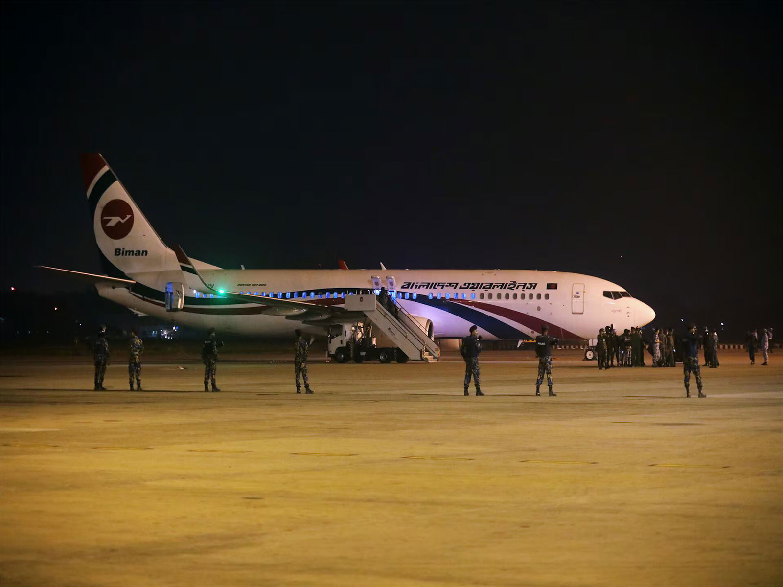 Security personnel are seen stationed near a Biman Bangladesh Airlines aircraft at Shah Amanat International Airport in Chittagong, Bangladesh. (Photo/Reuters)