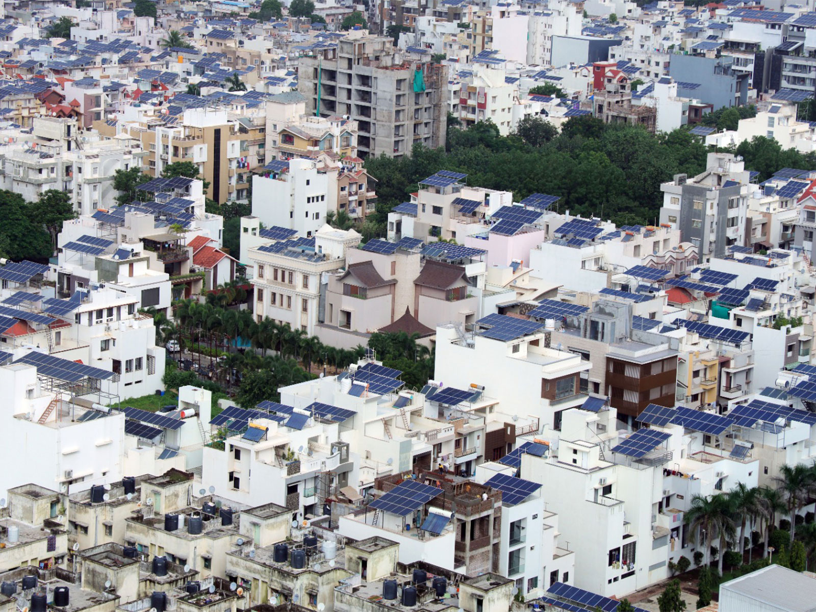Solar panel isntallations on rooftops in Gujarat (Photo/Gujarat CMO) Solar panel isntallations on rooftops in Gujarat (Photo/Gujarat CMO)