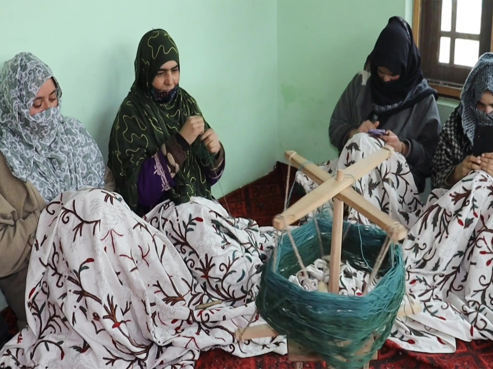 Women entrepreneurs weaving wool (Photo/ANI)