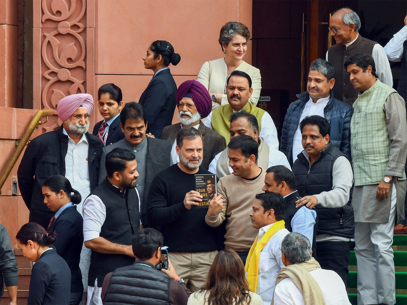 Lok Sabha LoP Rahul Gandhi holds the book 'Four Stars of Destiny' by former Army Chief General Manoj Mukund Naravane (Photo/ANI)