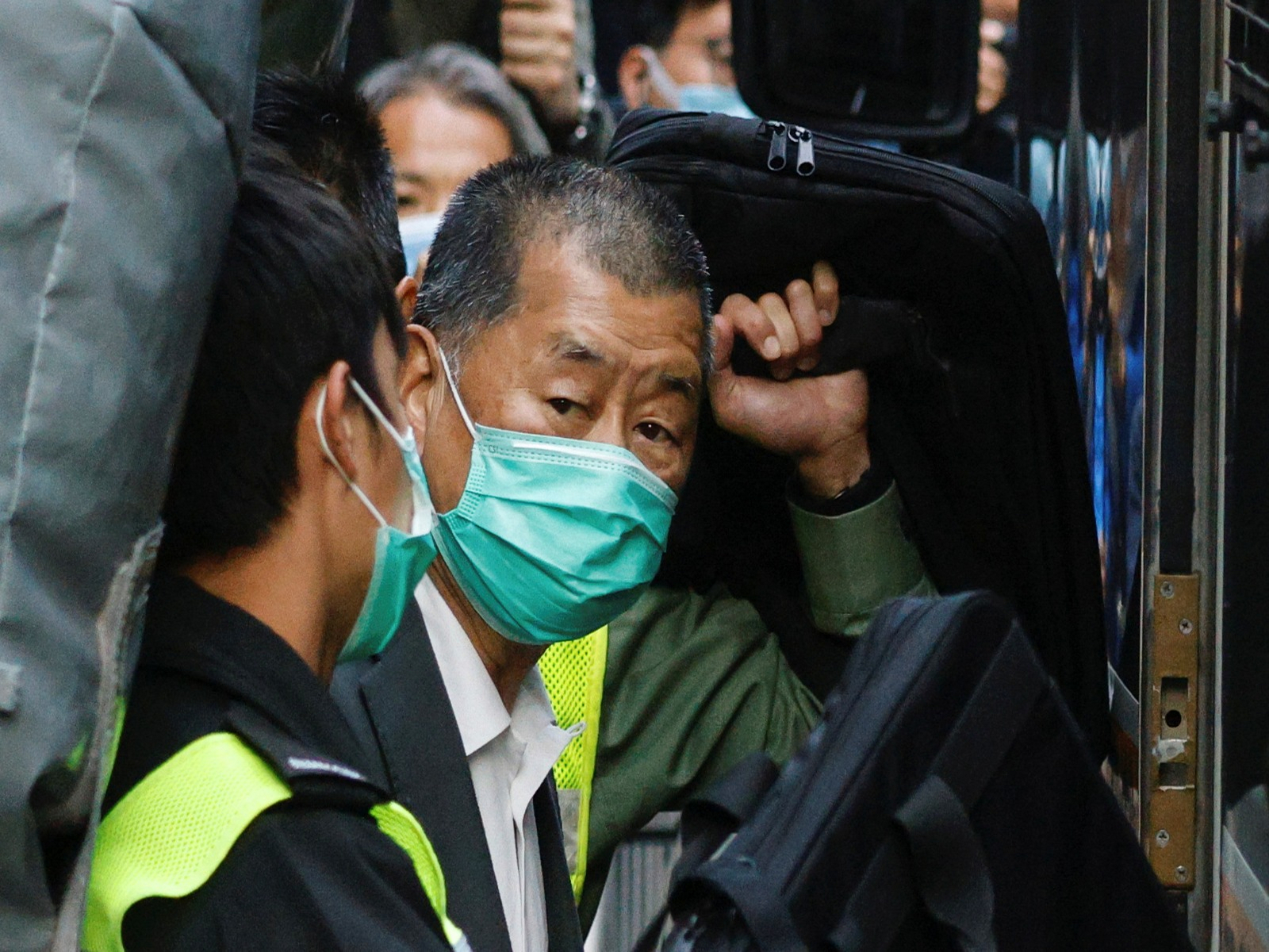 Media tycoon Jimmy Lai, founder of Apple Daily, looks on as he leaves the Court of Final Appeal by prison van, in Hong Kong (File Photo/Reuters)