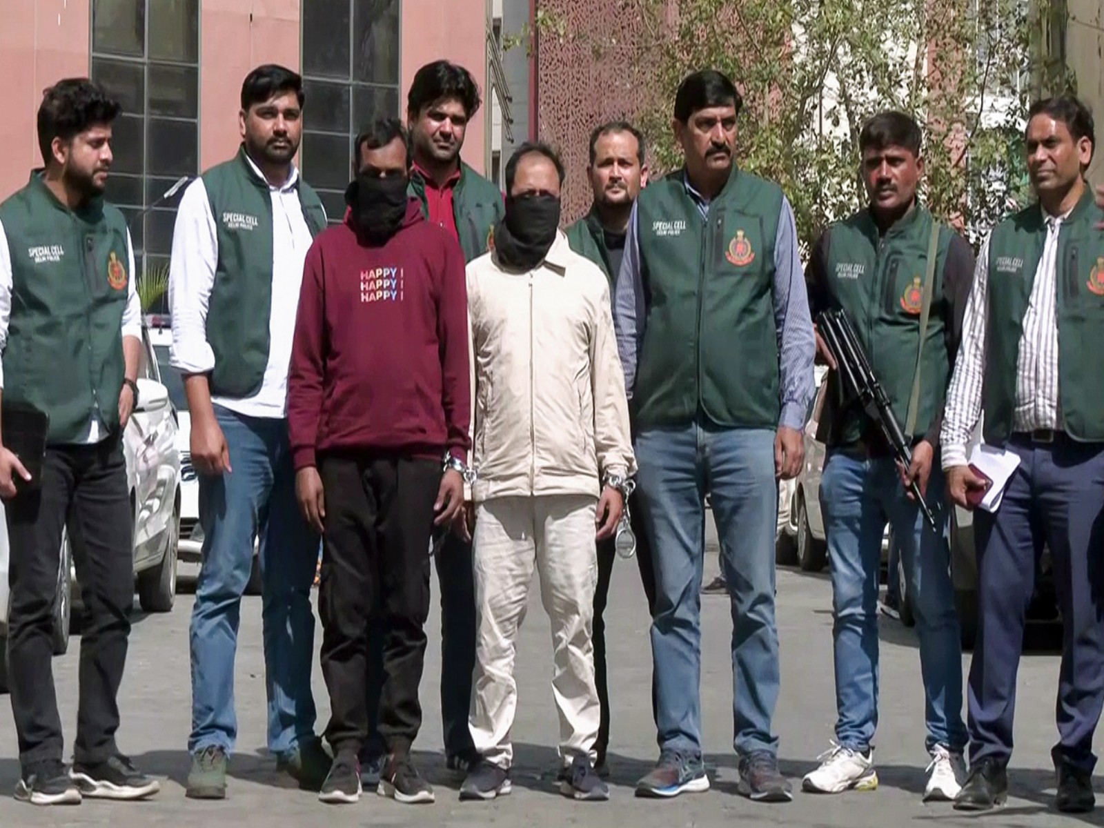 Delhi Police team with two of the arrested accused (Photo/ANI)