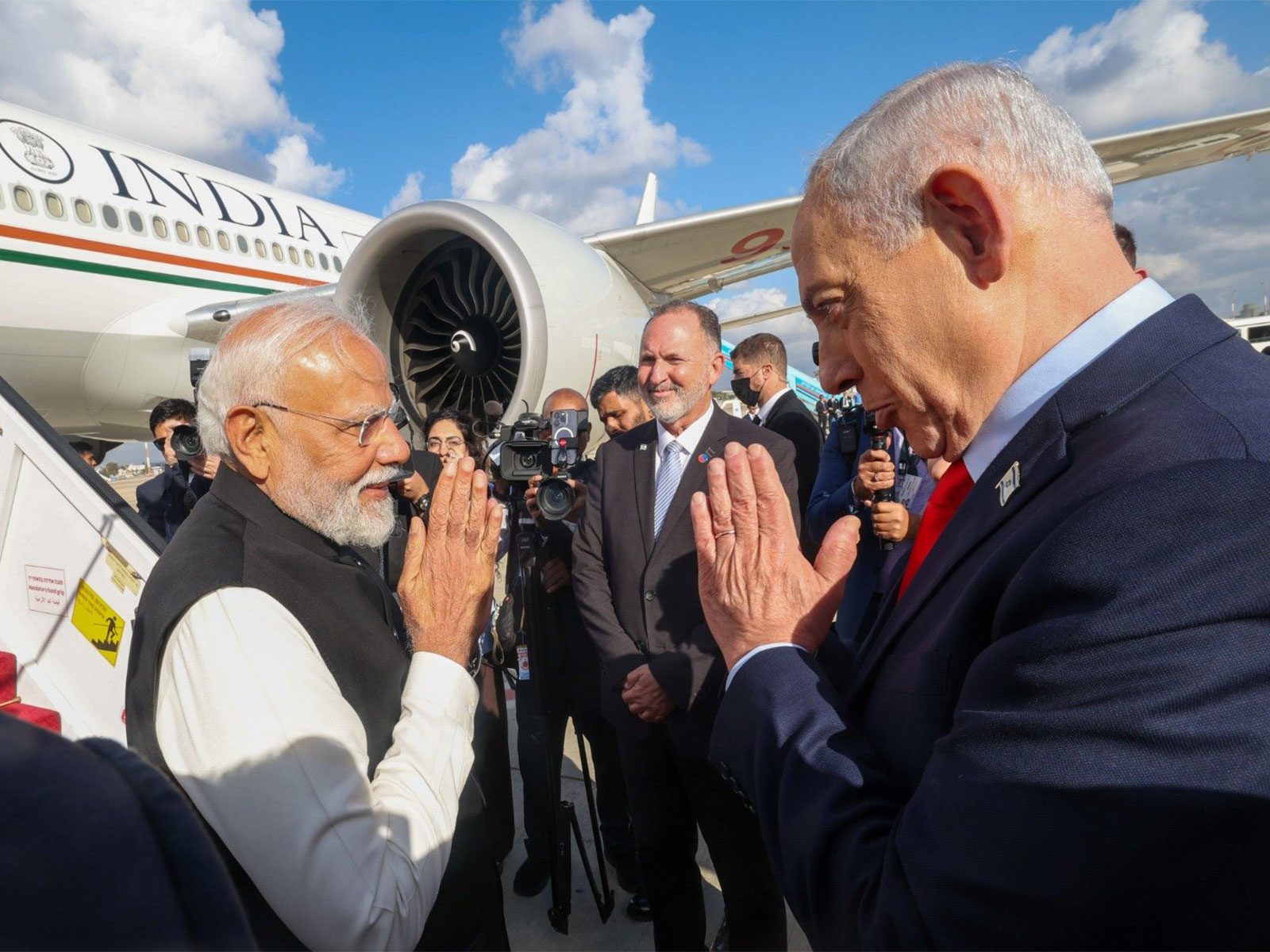 Prime Minister Narendra Modi exchanges greetings with Israeli Prime Minister Benjamin Netanyahu as he departs from Ben Gurion International Airport at the conclusion of his state visit to Israel. (Photo: X/@narendramodi)