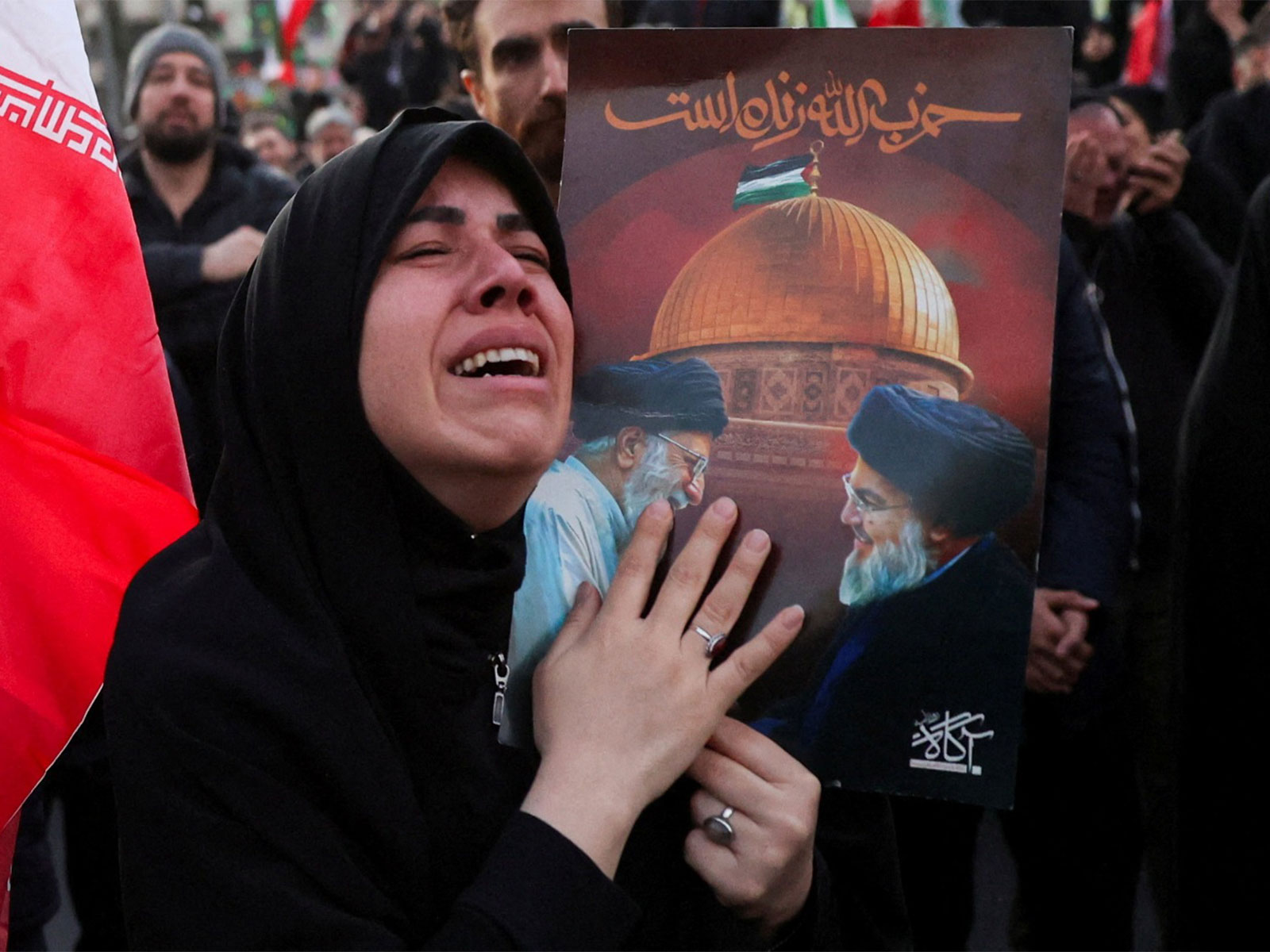 A woman reacts as people gather at the Enghelab Square, after Iran's Supreme Leader Ayatollah Ali Khamenei was killed in Israeli and U.S. strikes (Photo/ WANA via Reuters)