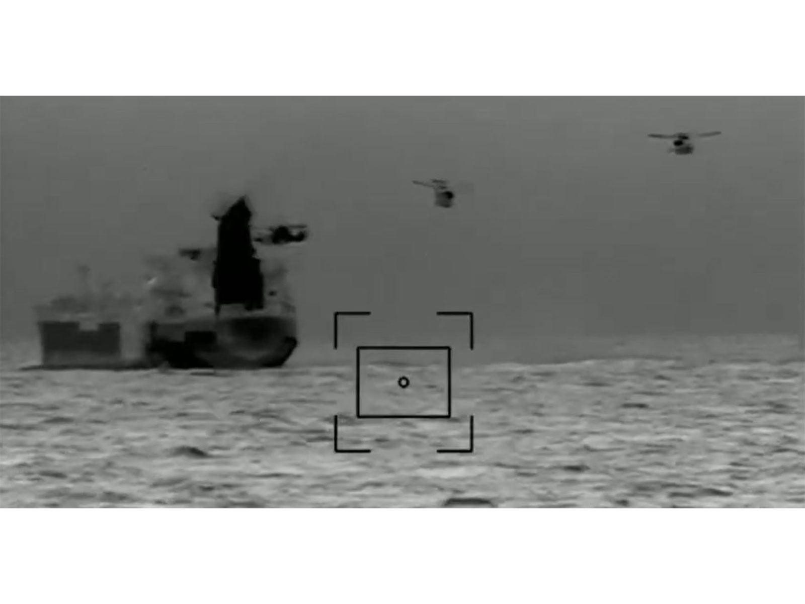 A French Navy helicopter hovers over the A French Navy helicopter hovers over the