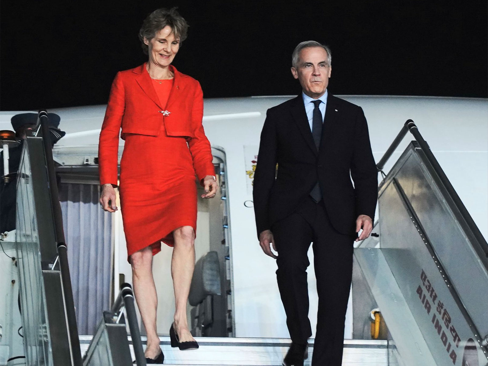 Canadian Prime Minister Mark Carney and his spouse disembark from the aircraft upon arrival in New Delhi during his official visit to India. (Photo: X/@MEAIndia) Canadian Prime Minister Mark Carney and his spouse disembark from the aircraft upon arrival in New Delhi during his official visit to India. (Photo: X/@MEAIndia)