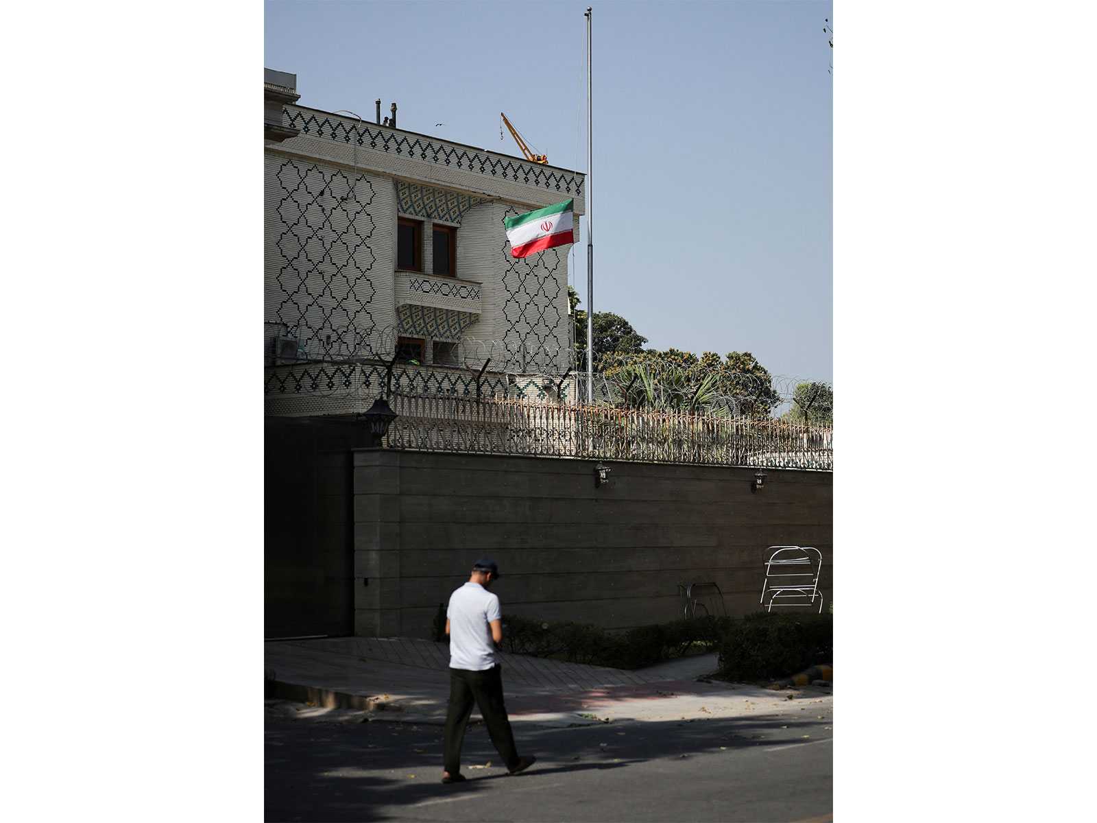 Iran’s national flag is lowered to half mast after Iran's Supreme Leader Ayatollah Ali Khamenei was killed in Israeli and U.S. strikes on Saturday, at the Iran's embassy in New Delhi (Photo/Reuters)