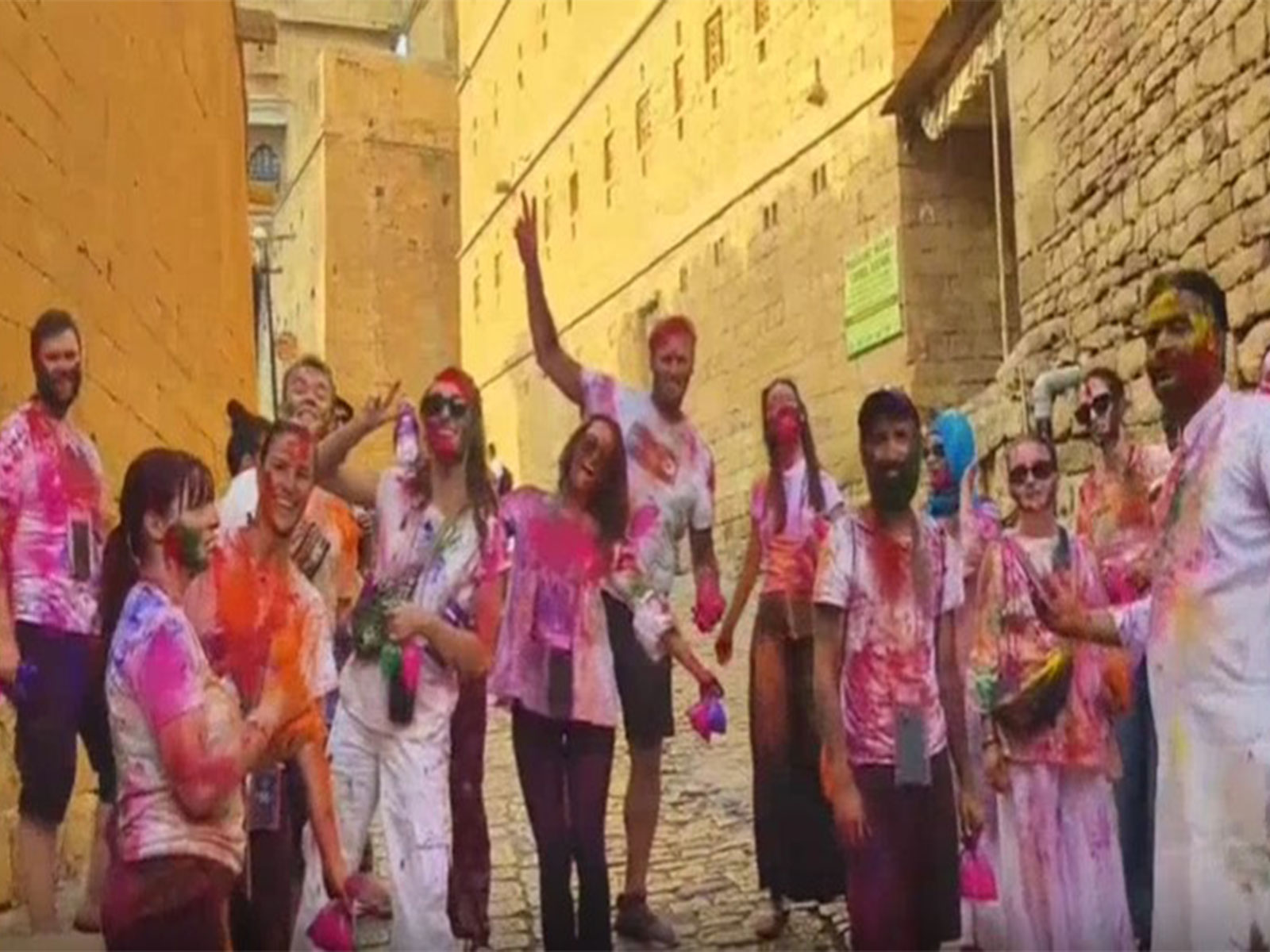 Foreign tourists playing Holi with locals in Jaisalmer (Photo/ANI)