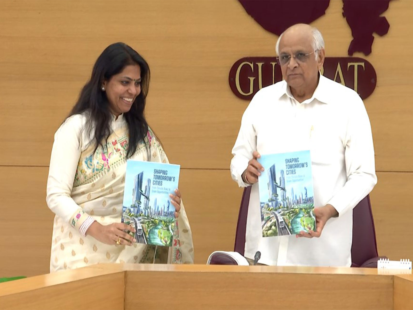 Gujarat CM Patel releases the book “Shaping Tomorrow’s Cities –From Climate Risk to Green Opportunities” (Photo/Gujarat CMO)